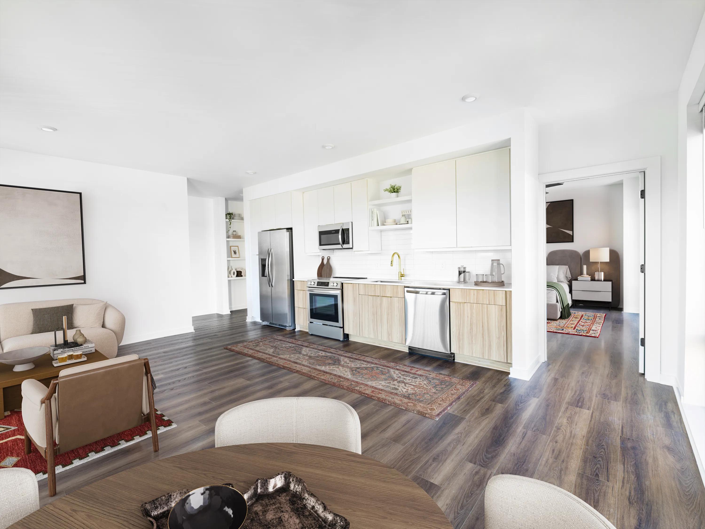 open floor plan living area with hardwood style flooring modera nations nashville tn apartments for rent