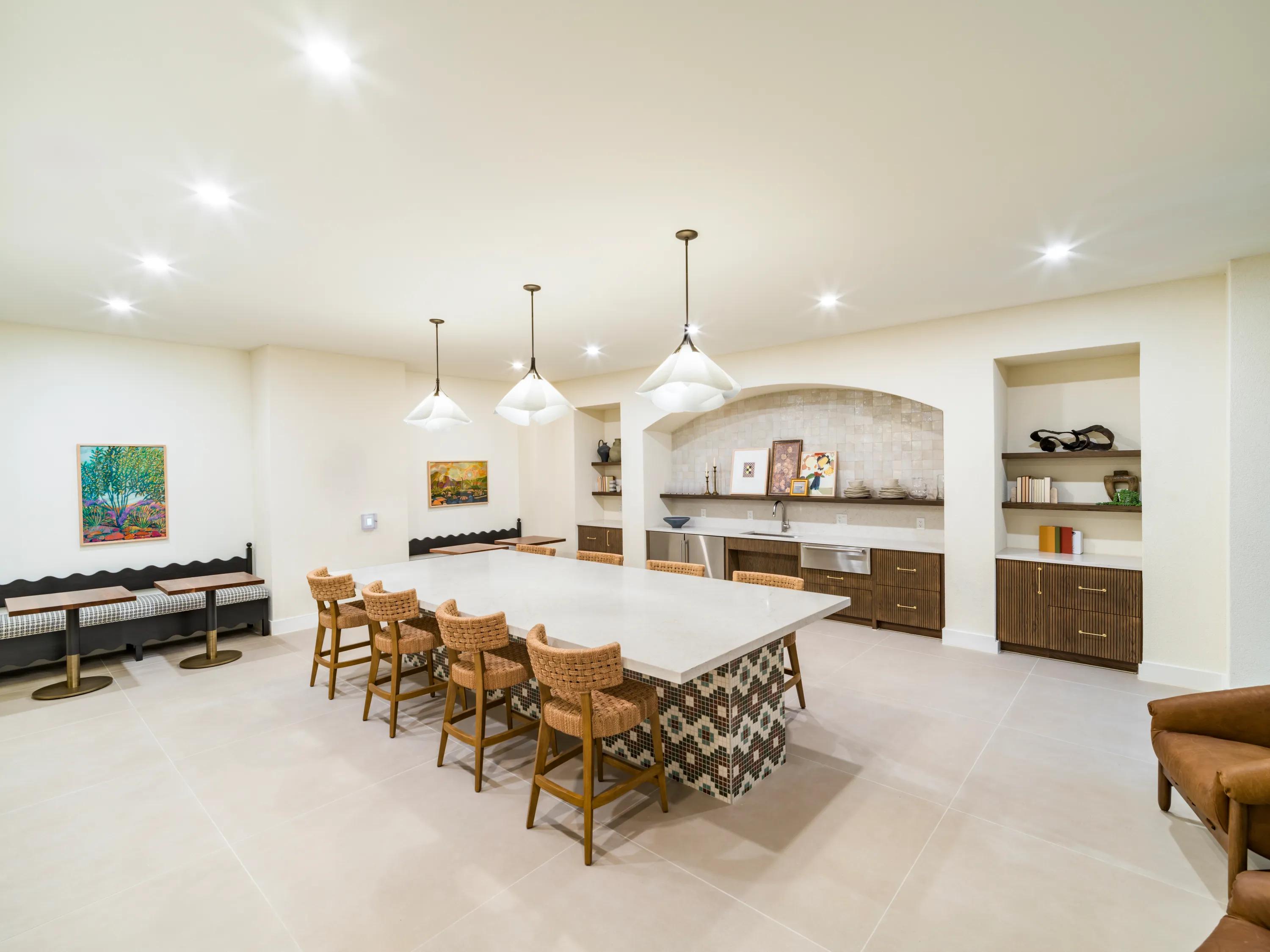 demonstration kitchen in clubroom near exit to pool modera trailhead apartment homes for rent in dallas tx