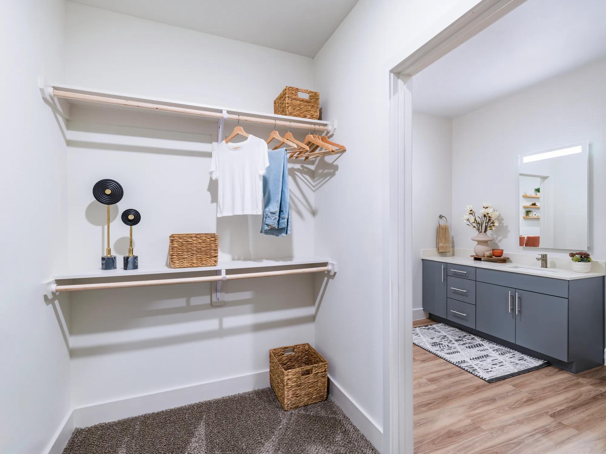 Large custom closet spaces with multi-tier shelving for plenty of storage