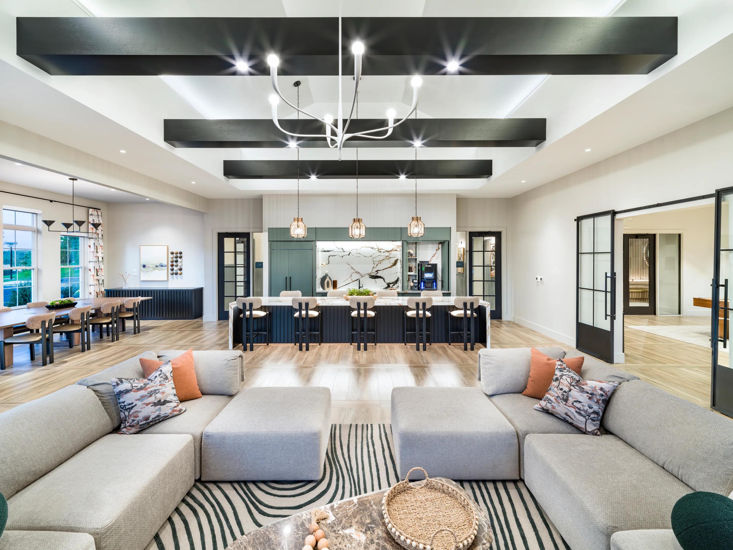community clubroom with comfortable lounge seating and coffee station modera south shore apartment homes for rent in marshfield ma