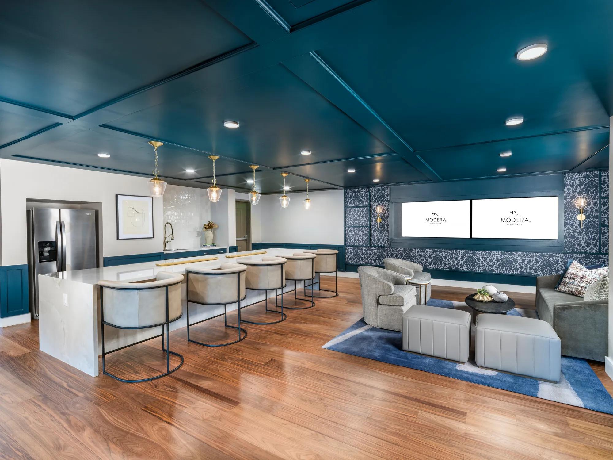 clubroom with comfortable couch and coworking spaces