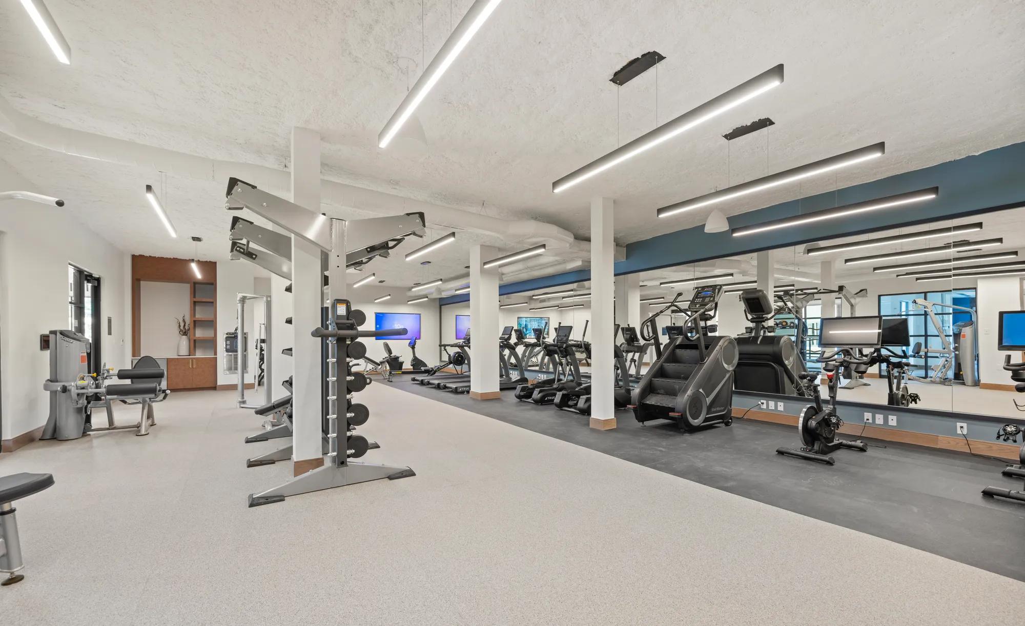 gitness center with weight and cardio equipment at modera newton apartment homes for rent in ma