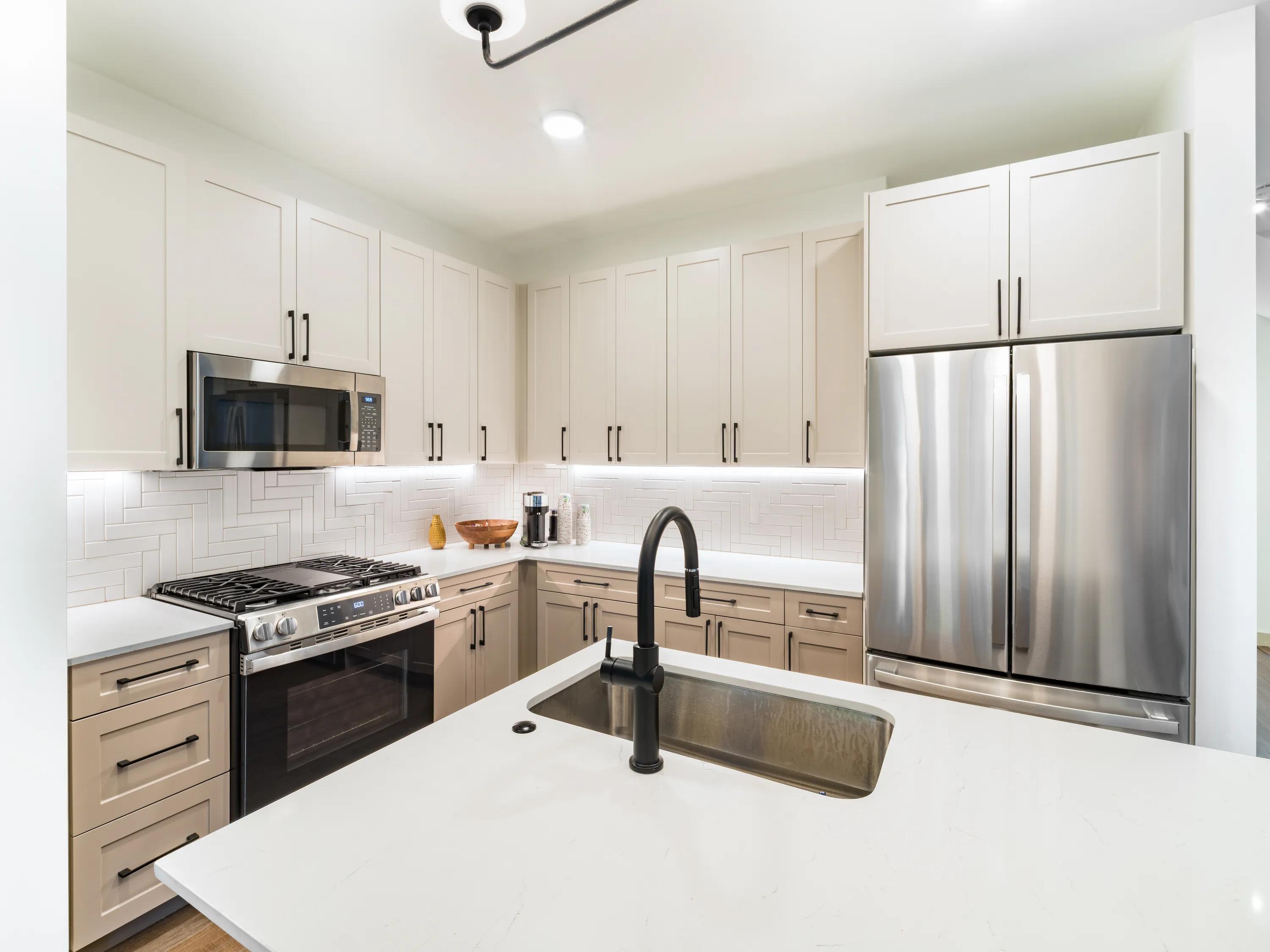 Kitchen with neutral-tone cabinetry modera weston apartments and townhomes for rent  for rent in weston ma near boston