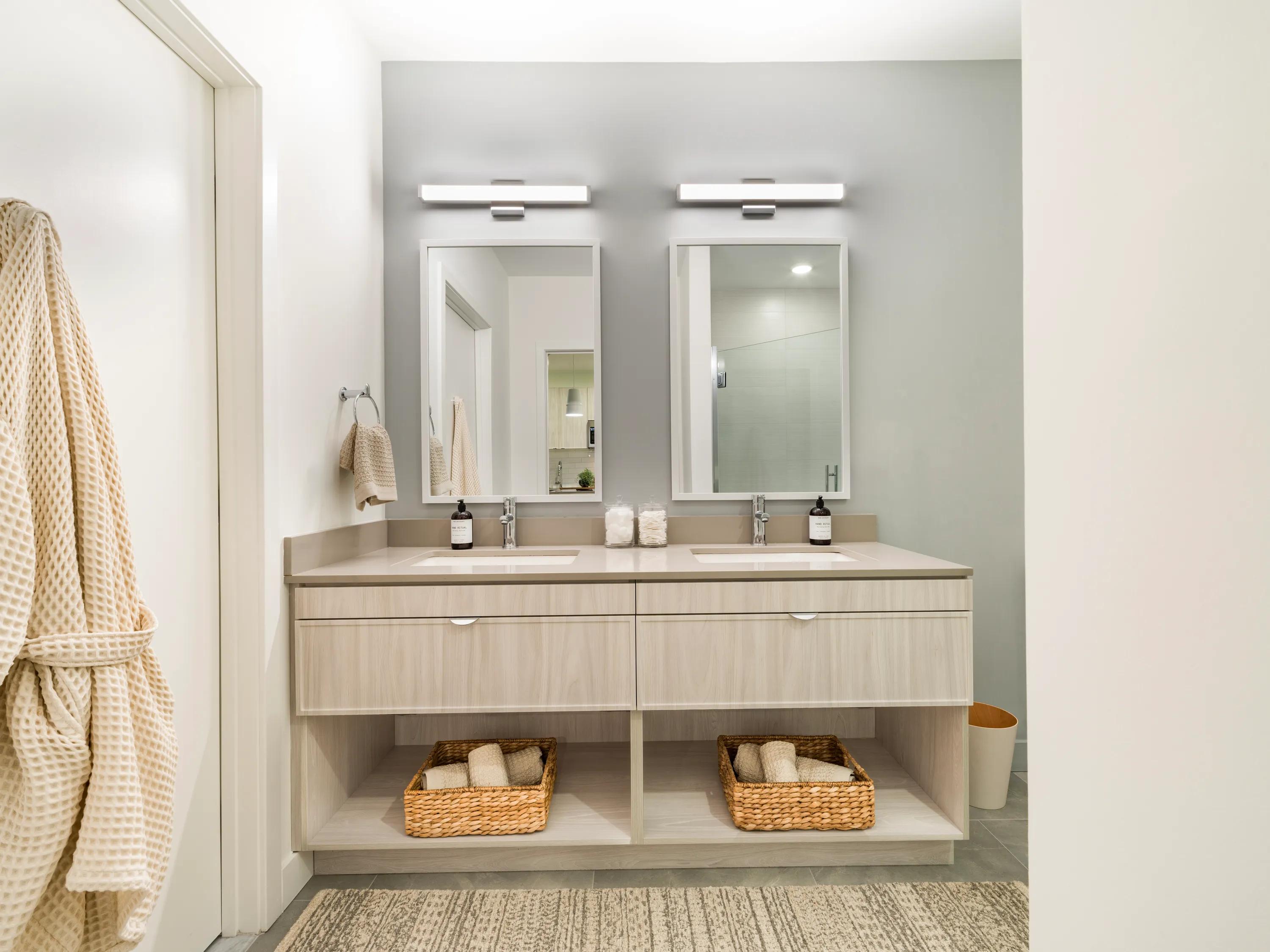 bathroom with quartz countertops and frameless glass shower modera revere beach apartment homes for rent in revere ma