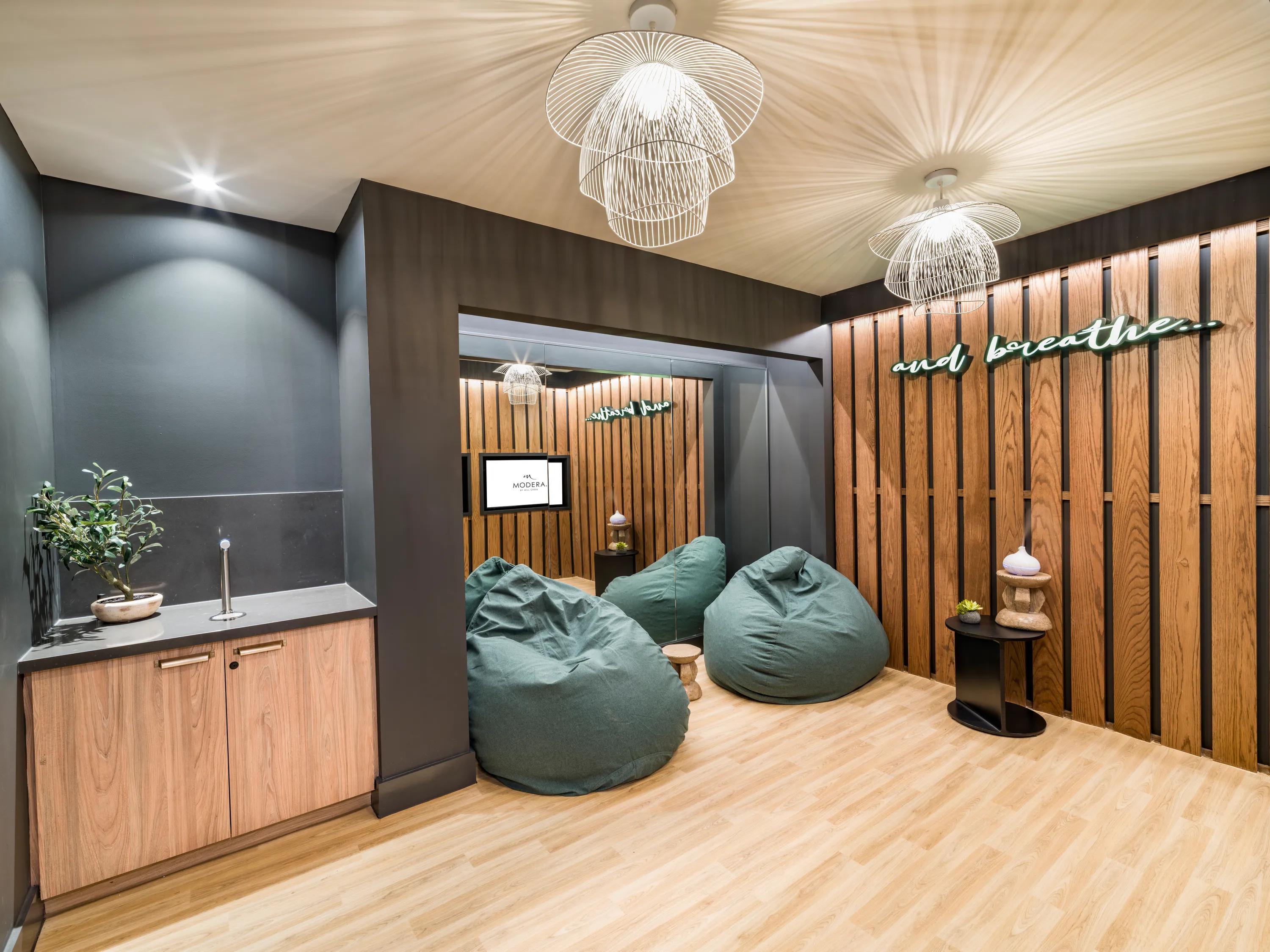 yoga and meditation room with large windows and mirror wall rendering modera st. paul apartment homes for rent in dallas tx