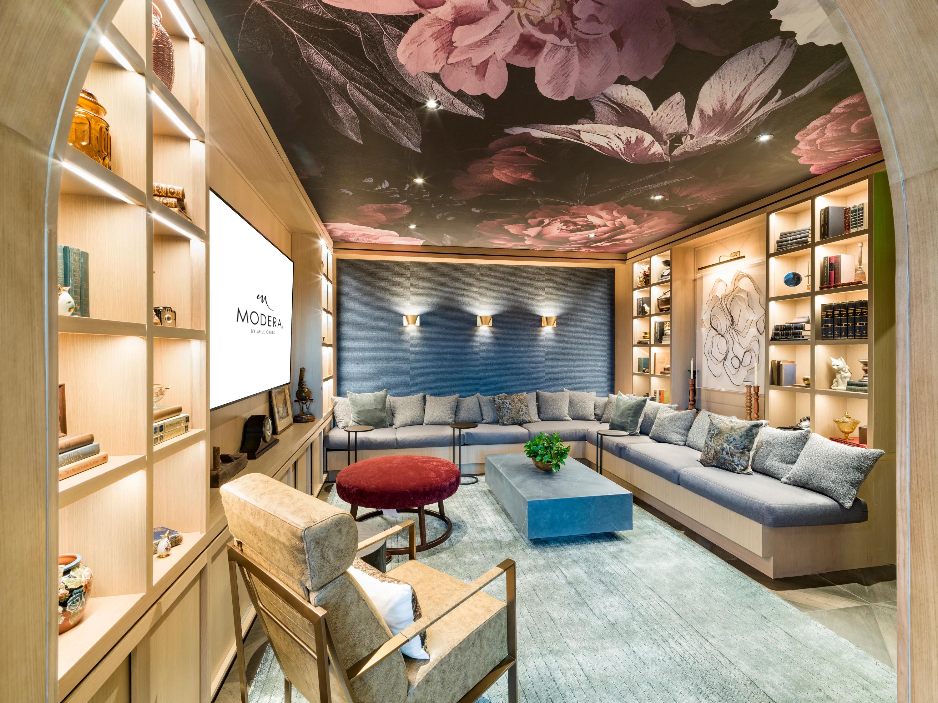 large media room with section couch at modera university park apartment homes for rent in denver co