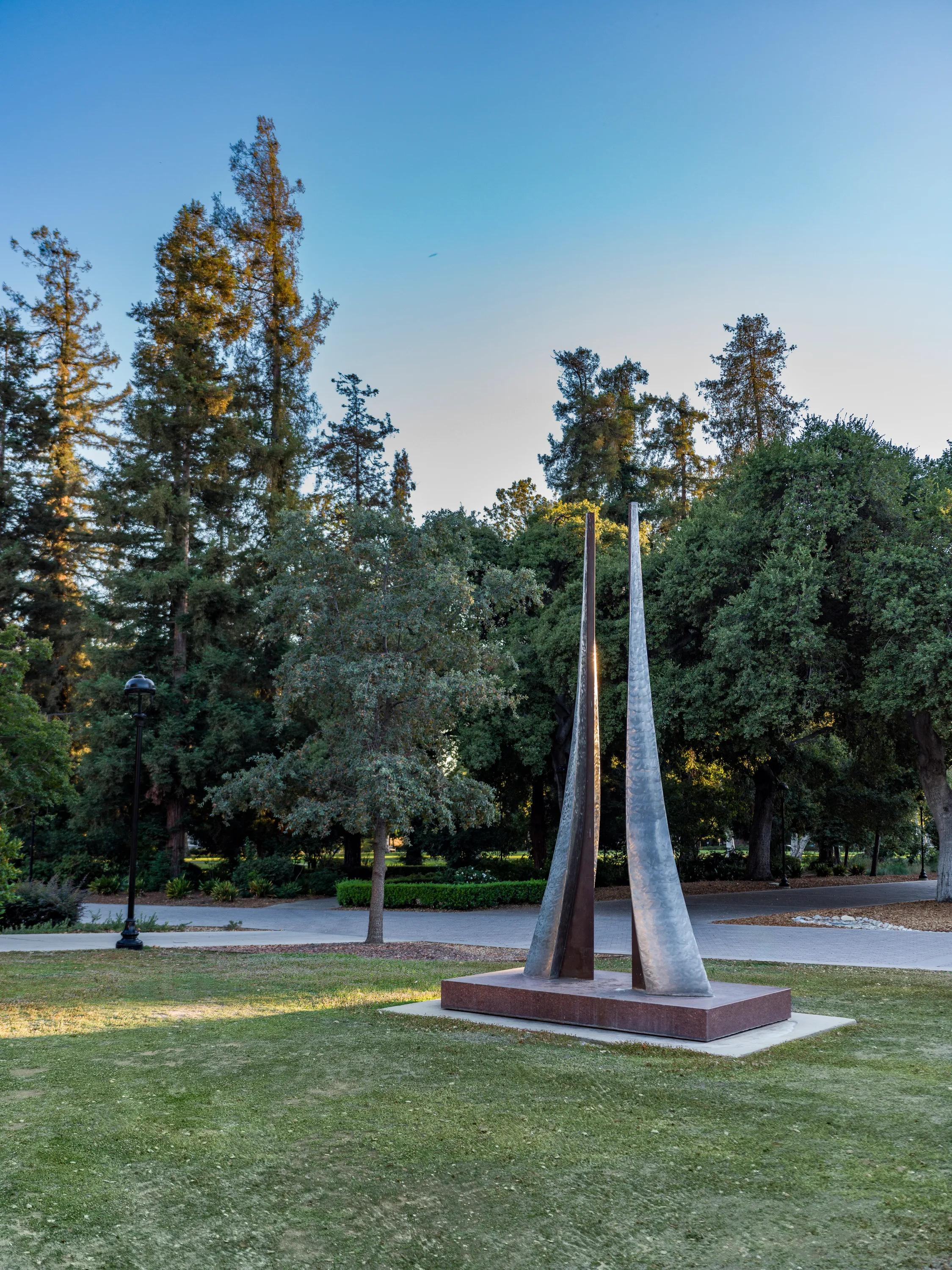 statue in park with trees modera pomona apartment homes for rent in ca