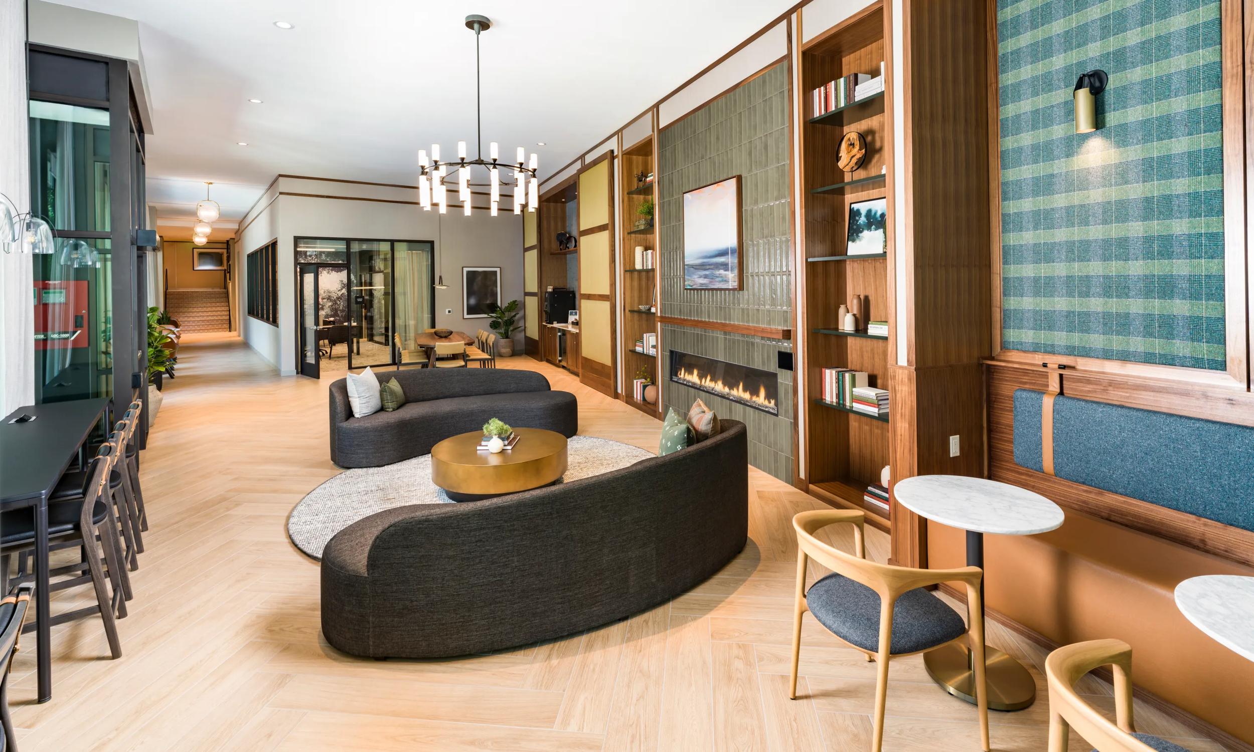 Chic living room with elegant wooden accents, cozy fireplace, and stylish seating area.