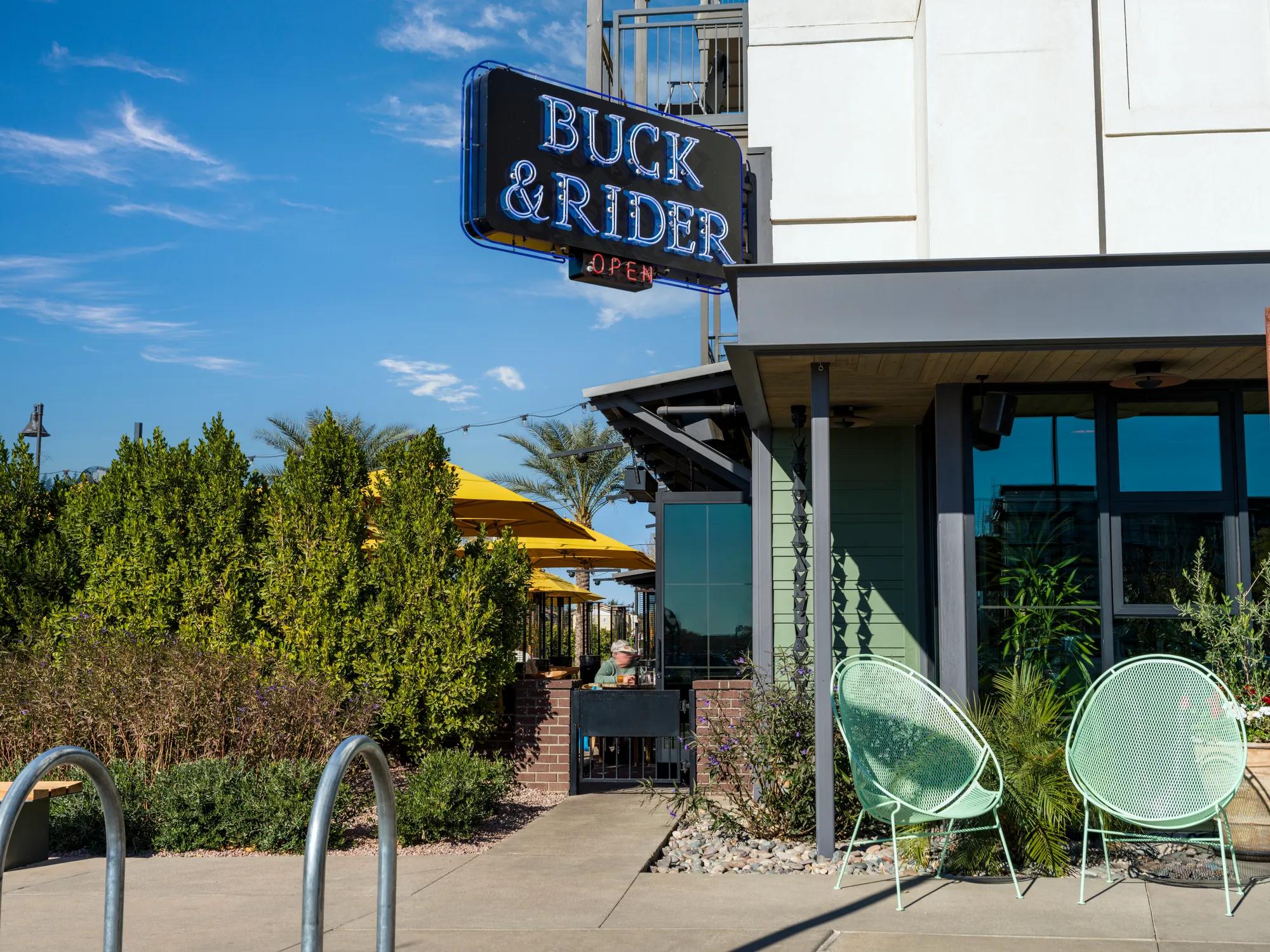 seafood restaurant with outdoor seating buck and rider at modera higley commons apartment homes for rent in gilbert az