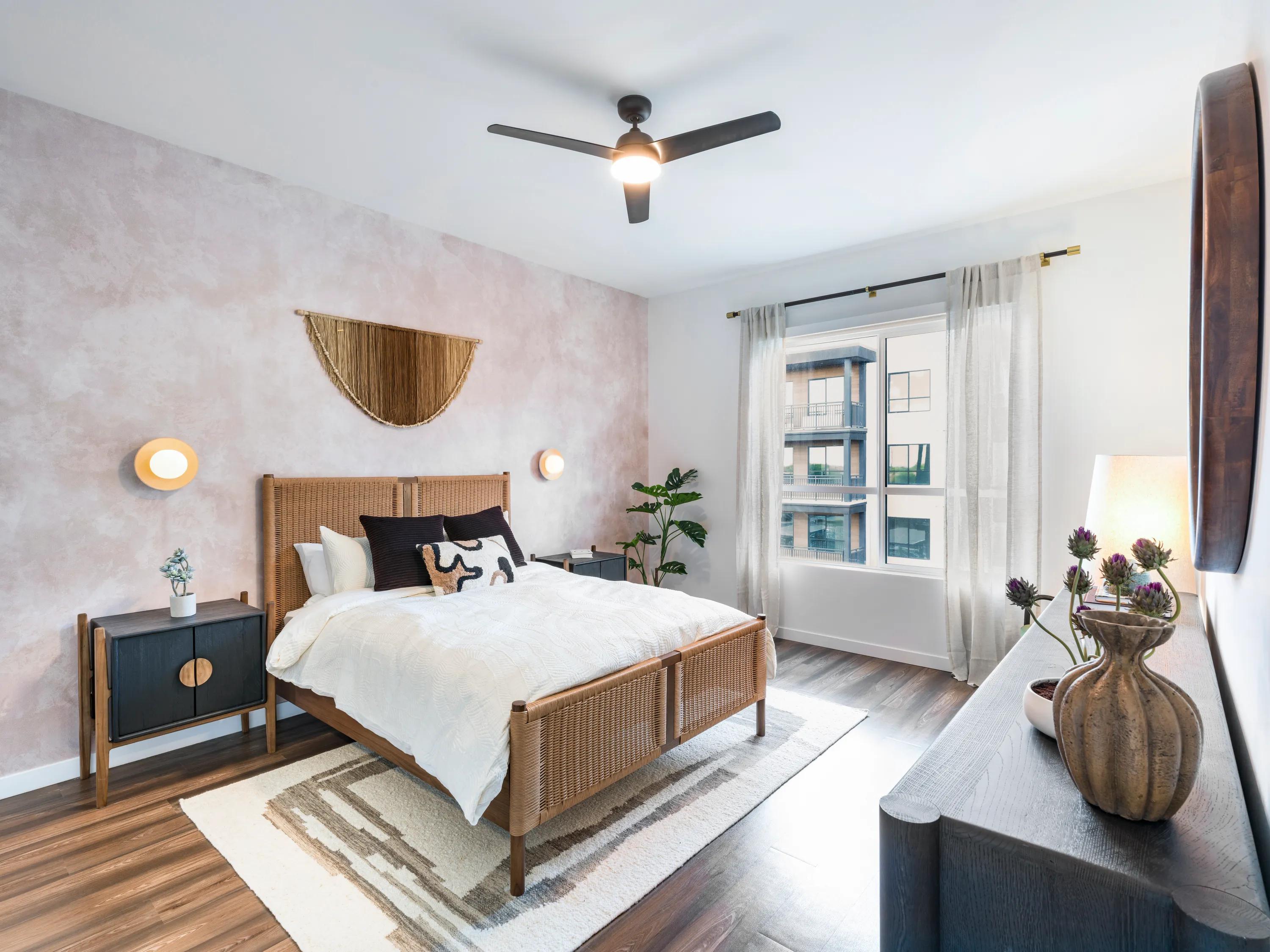 large bedroom with window and ceiling fan modera higley commons apartment homes for rent in gilbert az