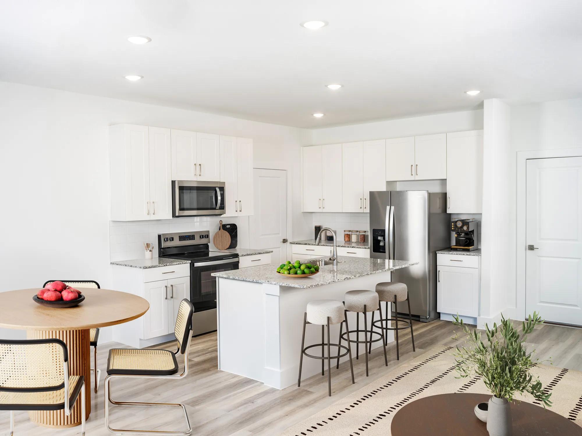 kitchen island with bar seating at amavi celina single family homes for rent in texas