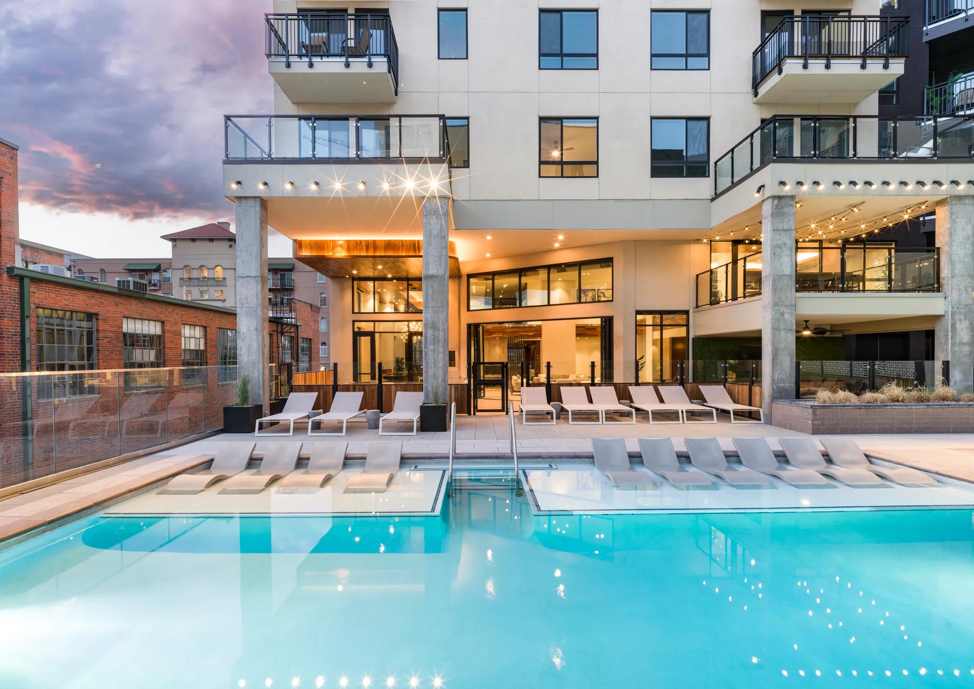 pool area with sundeck and lounge seating in water modera golden triangle apartment homes for rent in denver co