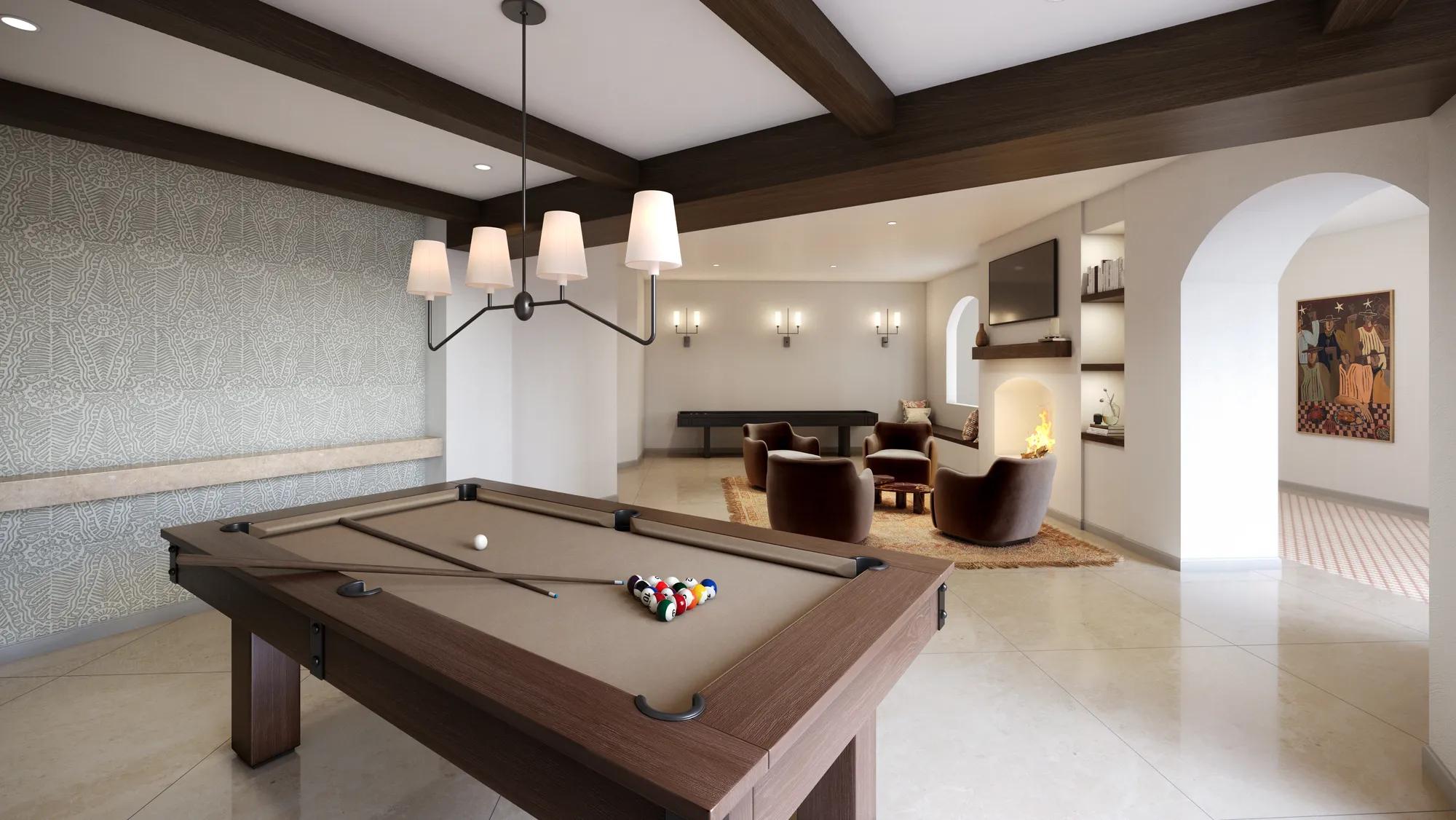 Poolside lounge area with pool tables and tvs modera trailhead apartments