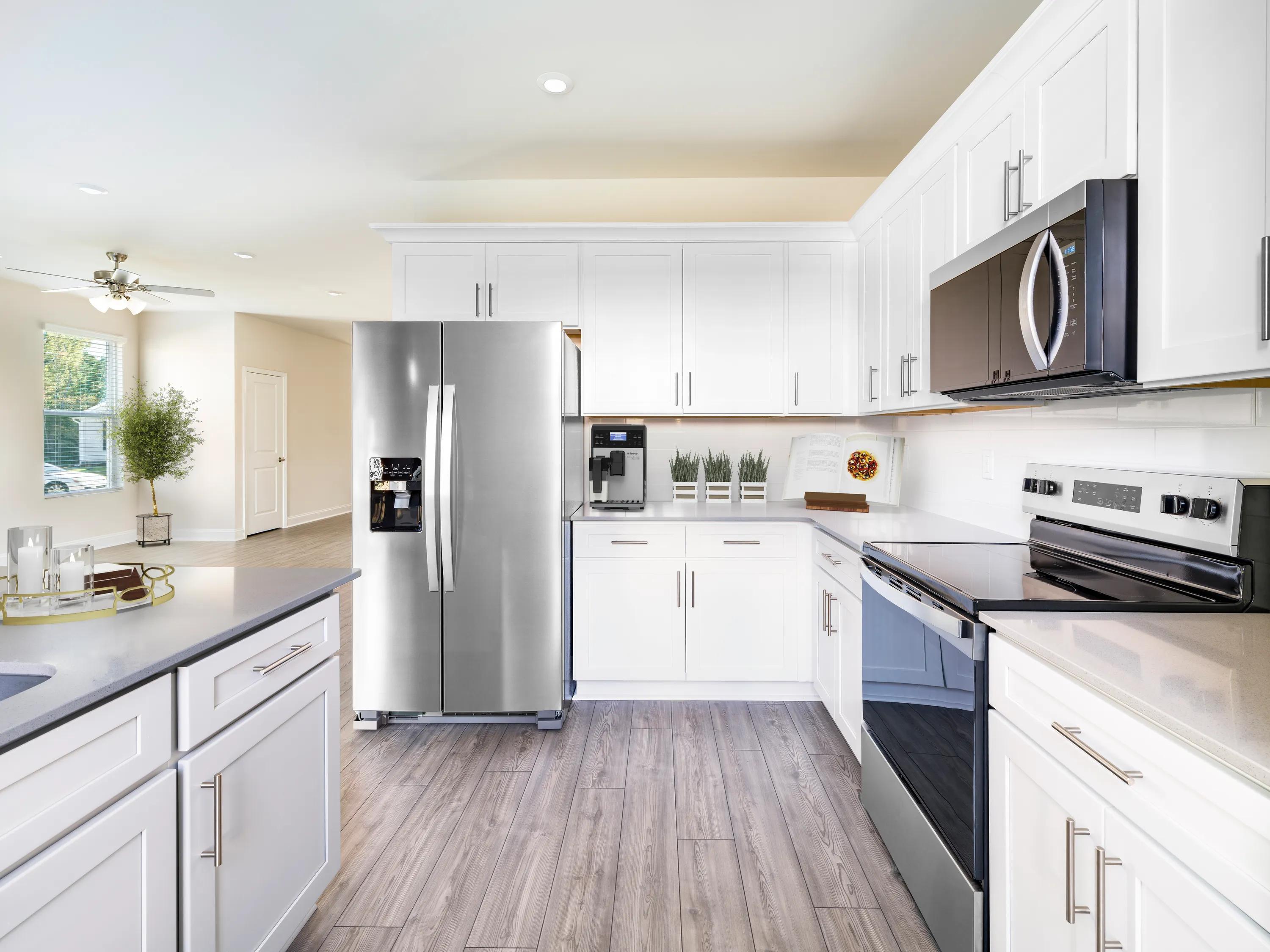 kitchen with stainless appliances amavi brier creek homes for rent in durham nc
