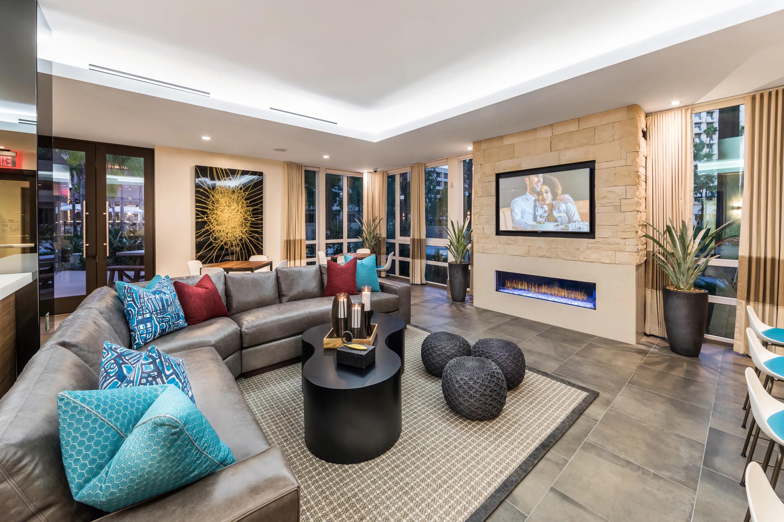 cozy lounge seating around fireplace 580 anton apartments for rent in costa mesa ca