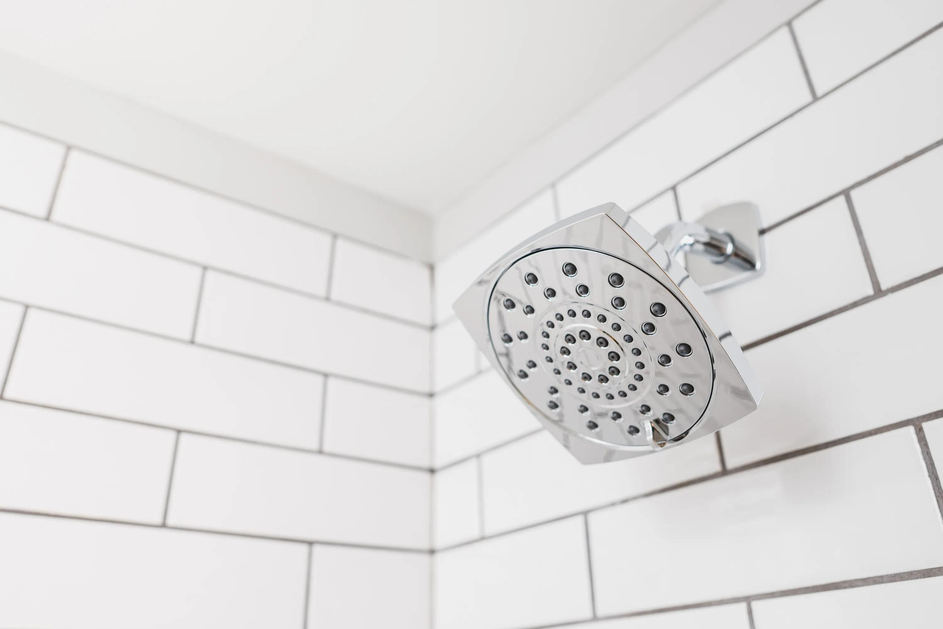 Spa-inspired shower with storage insert and modern subway tile