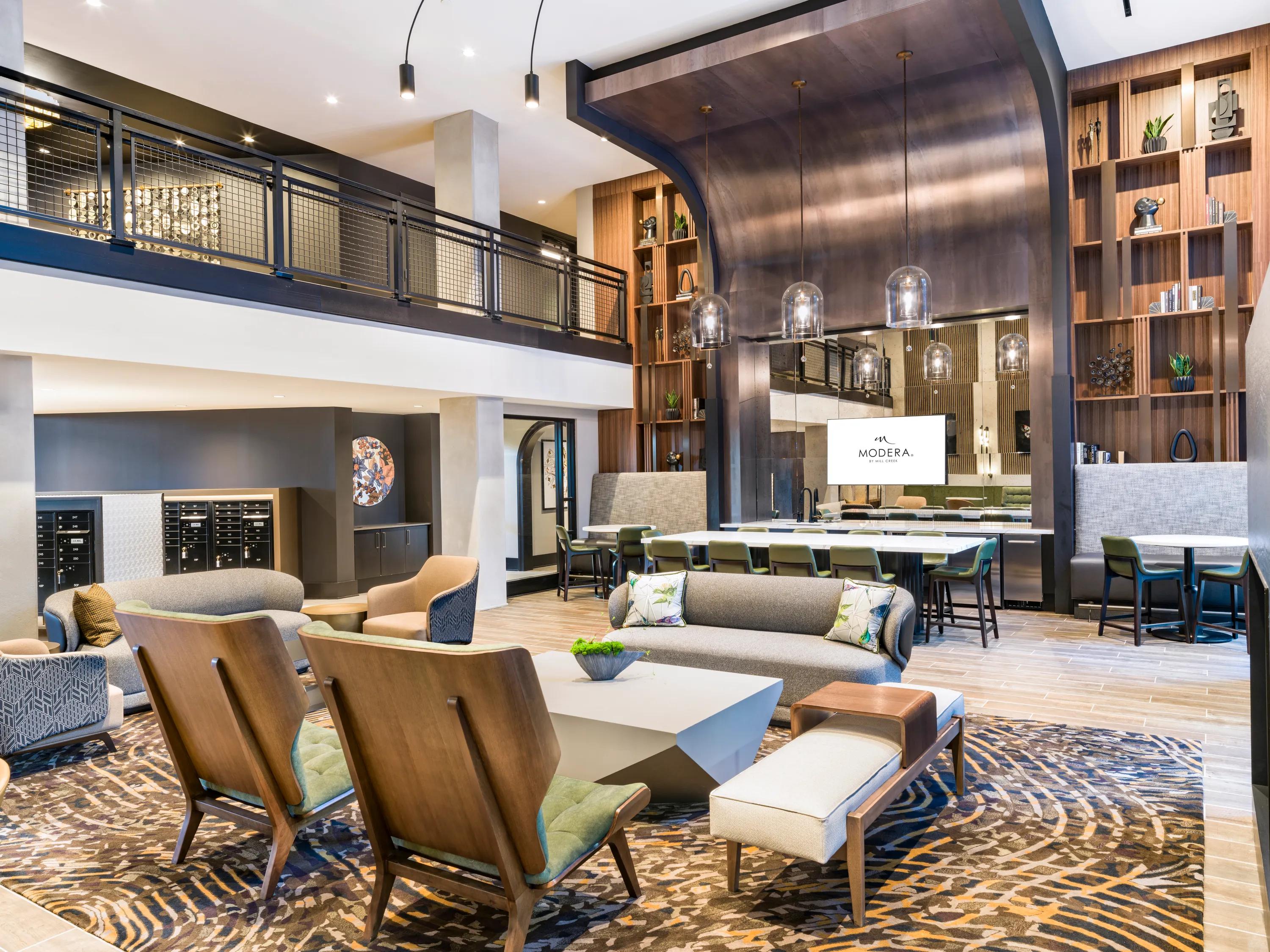 tastefully appointed clubroom with large windows and fireplace modera h street apartment homes for rent in washington dc