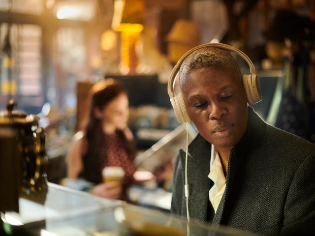 man with headphones on listening to music modera sobro apartment homes for rent in nashville tn