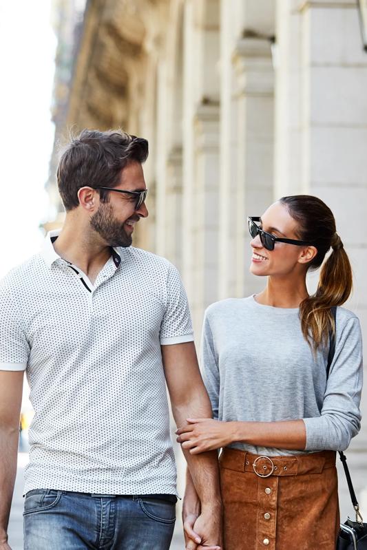 moders weston apartments for rent in weston ma near boston young couple holding hands and smiling at each other in front of a building with nice architecture