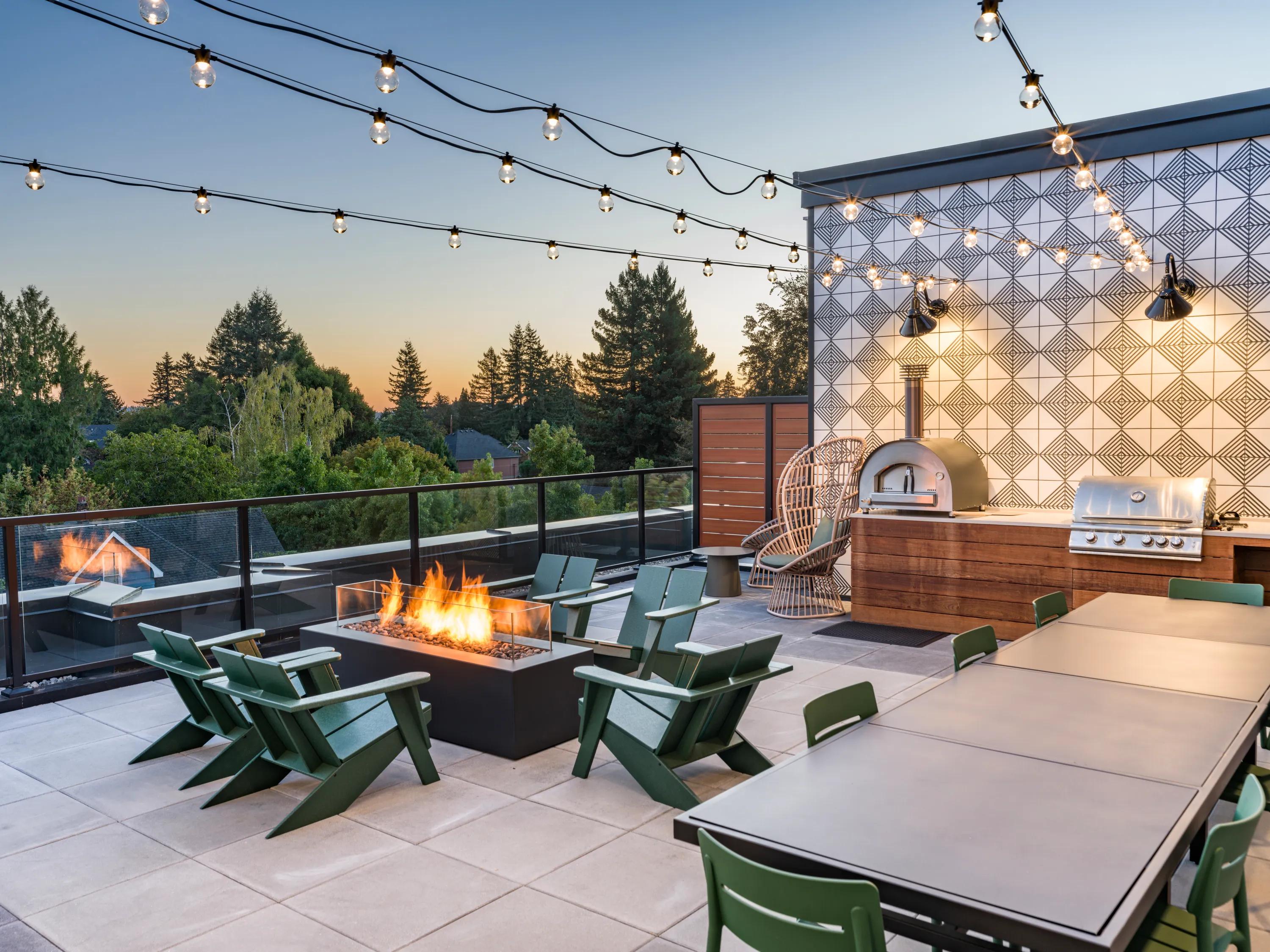 rooftop deck with bbq grills and wood fired pizza oven and fireplace