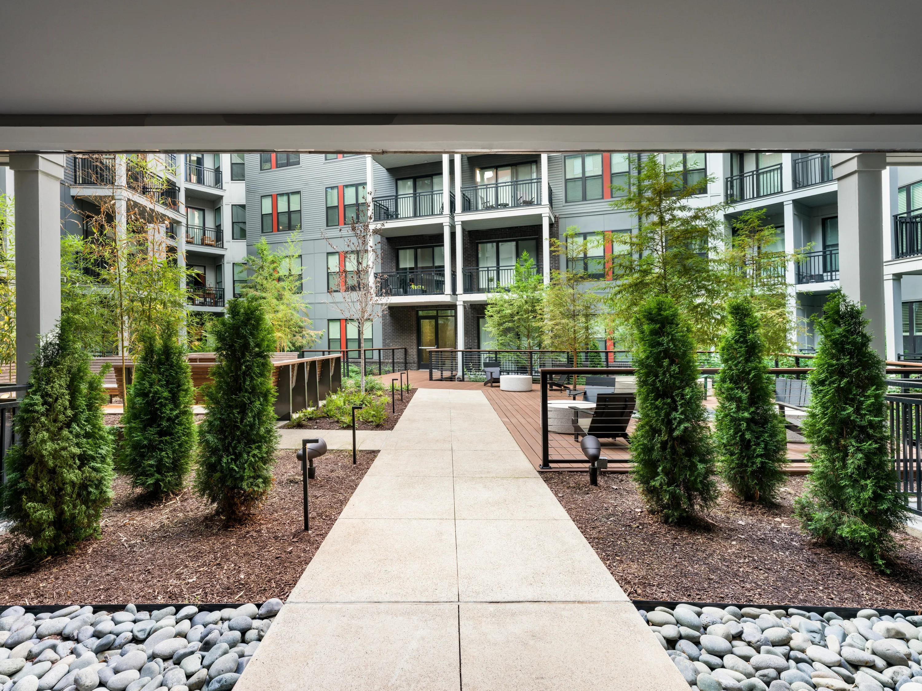 outdoor courtyard with walk way modera riverview apartment homes for rent in tn rendering