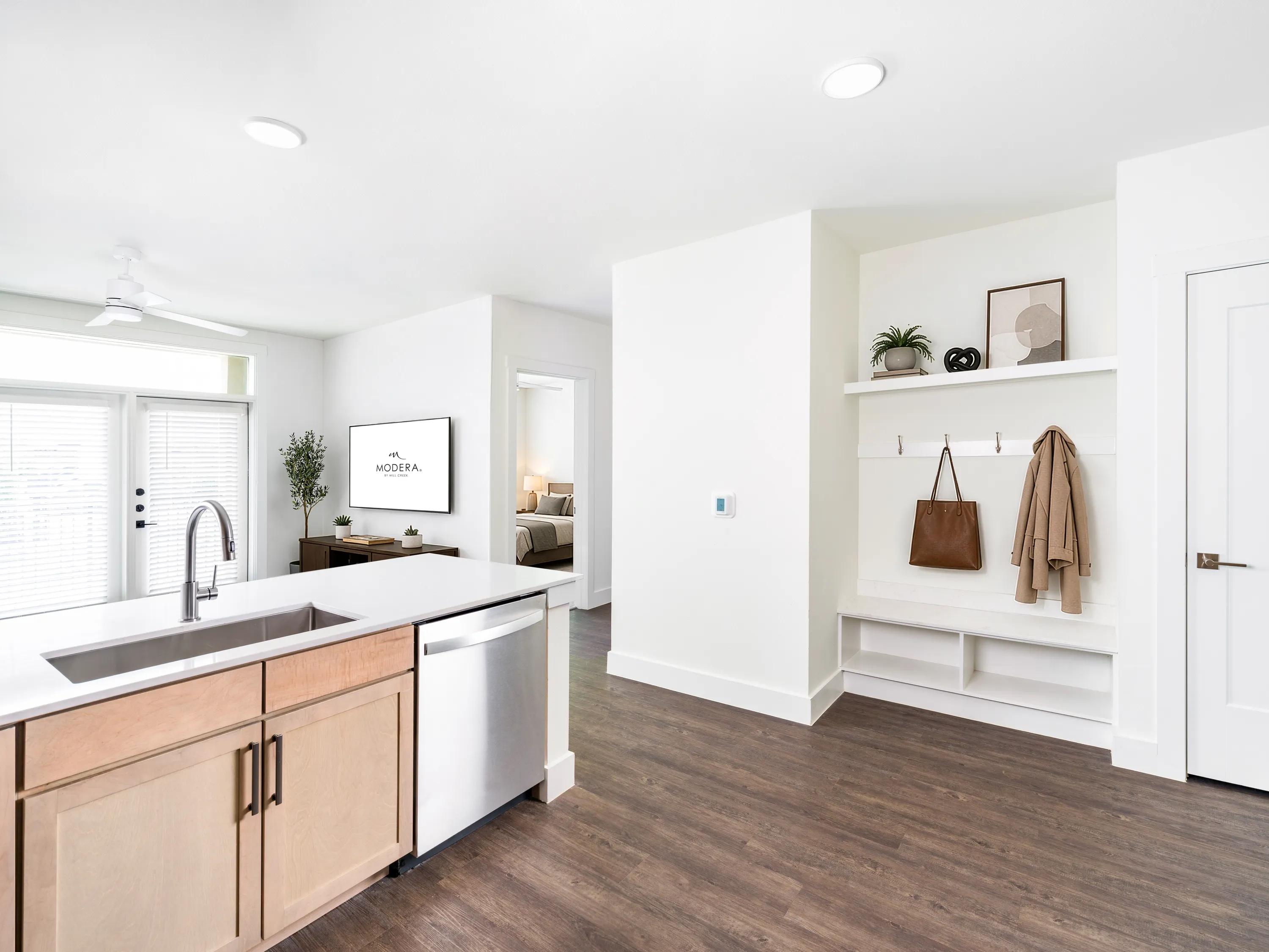 Open kitchen and living area with a central island modera trailhead apartment homes for rent in dallas texas