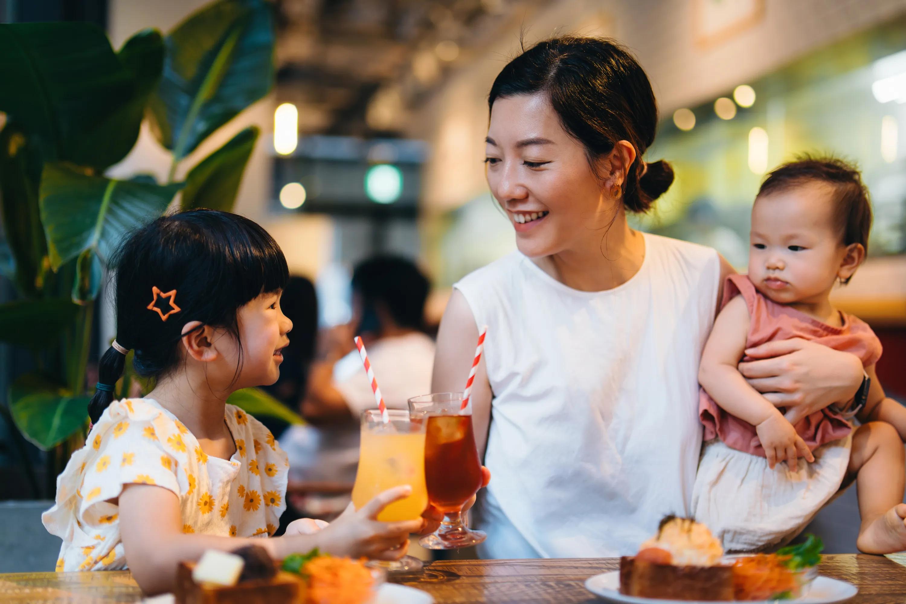 family at marketplace drinking juice modera h street apartment homes for rent