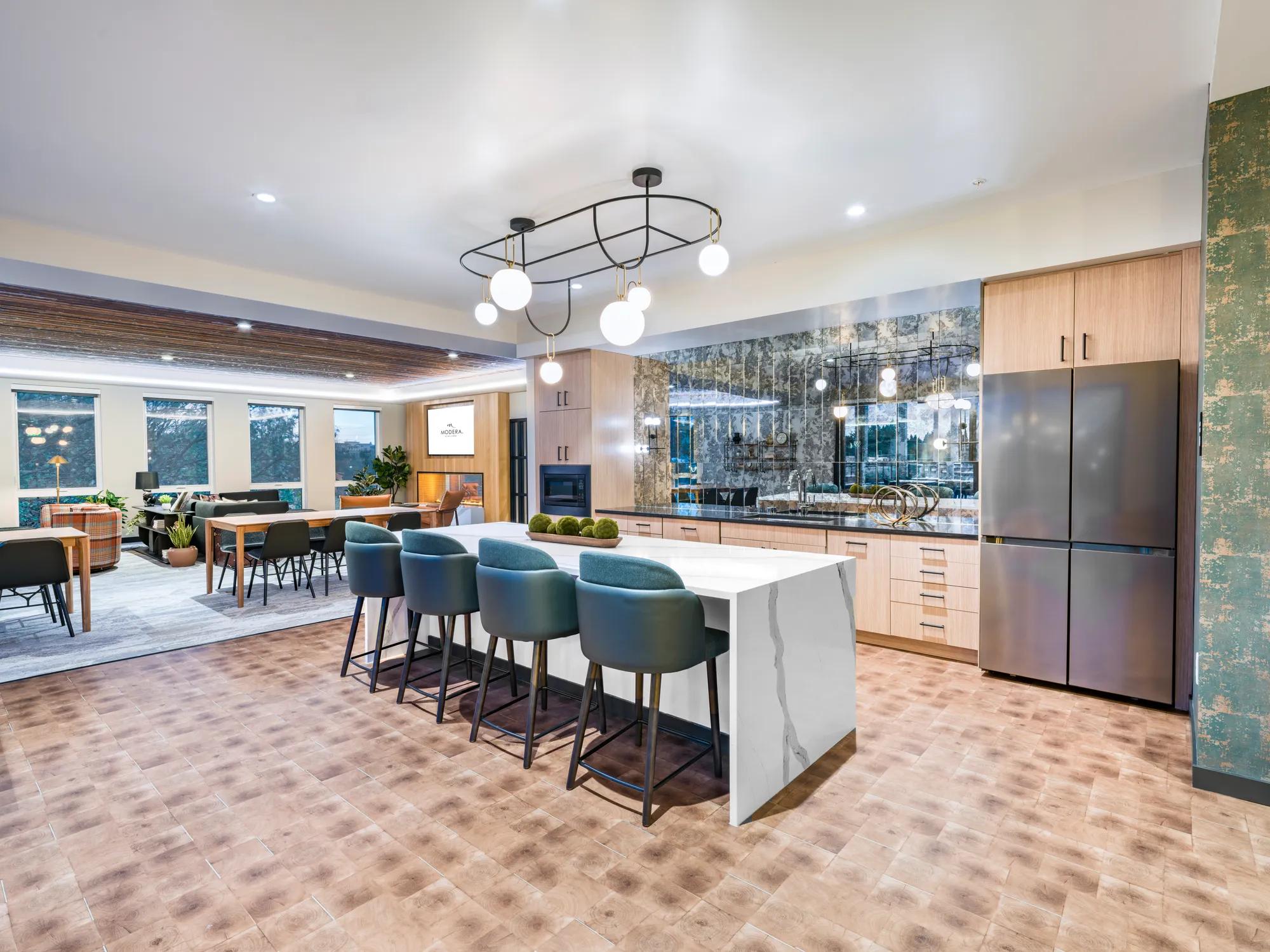 community kitchen with stainless steel appliances  modera northgate apartments seattle wa