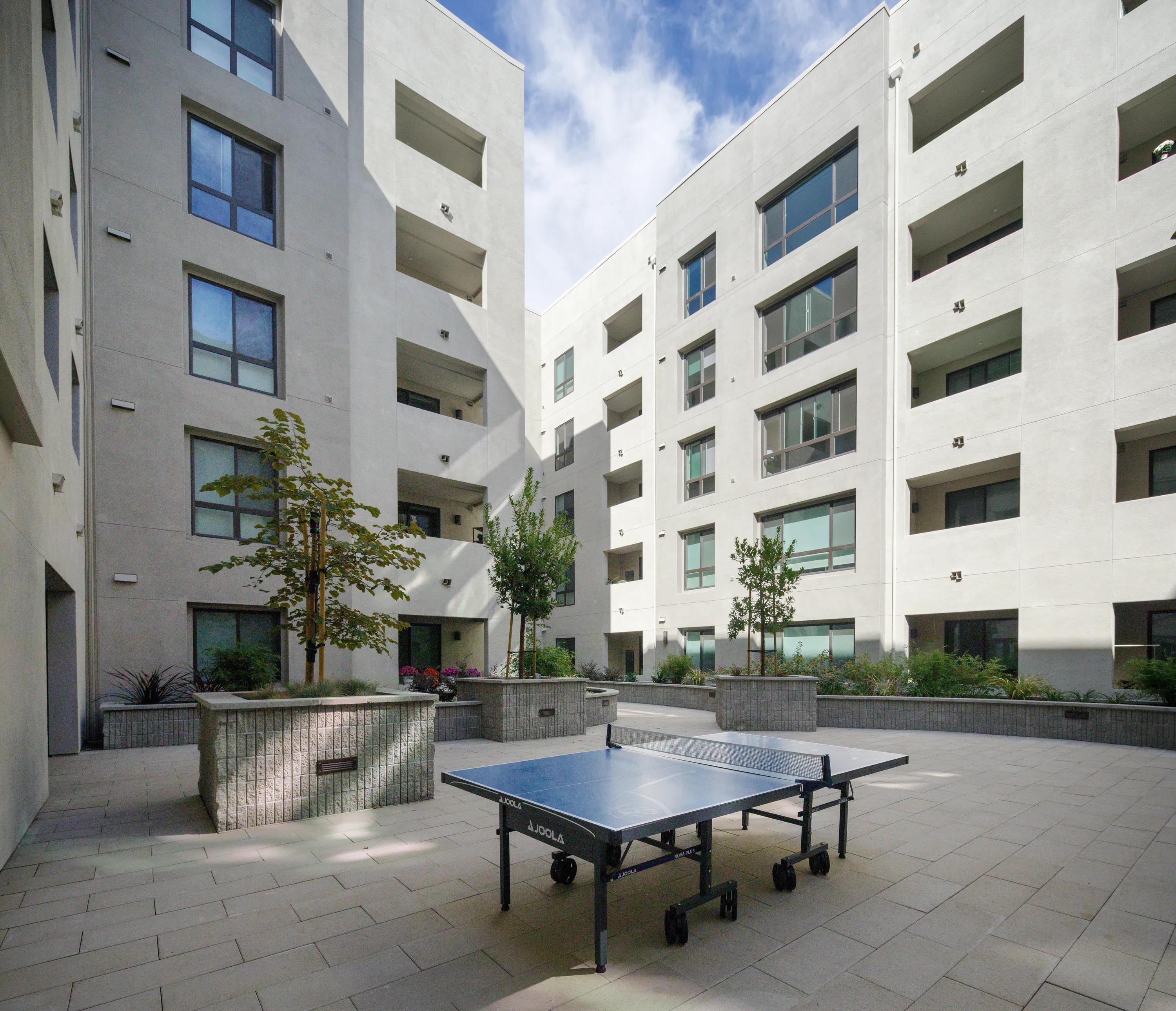 Active courtyard with lawn games vespaio apartments