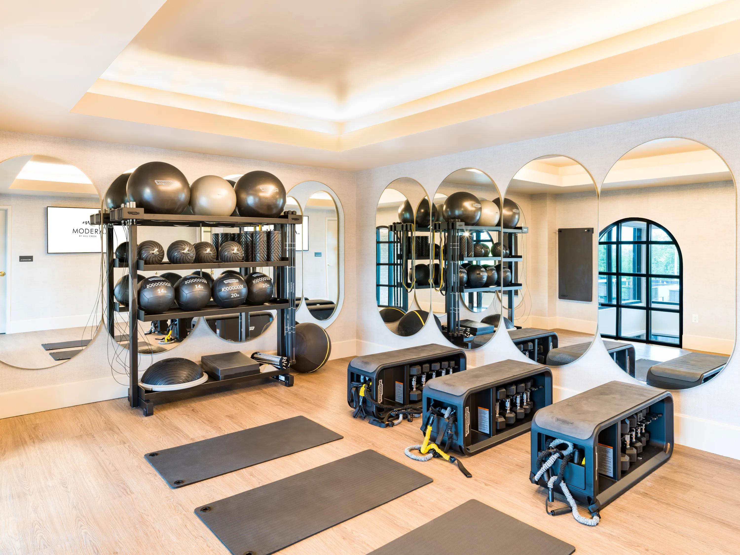yoga room with mats on floor at modera university park apartment homes for rent in denver co