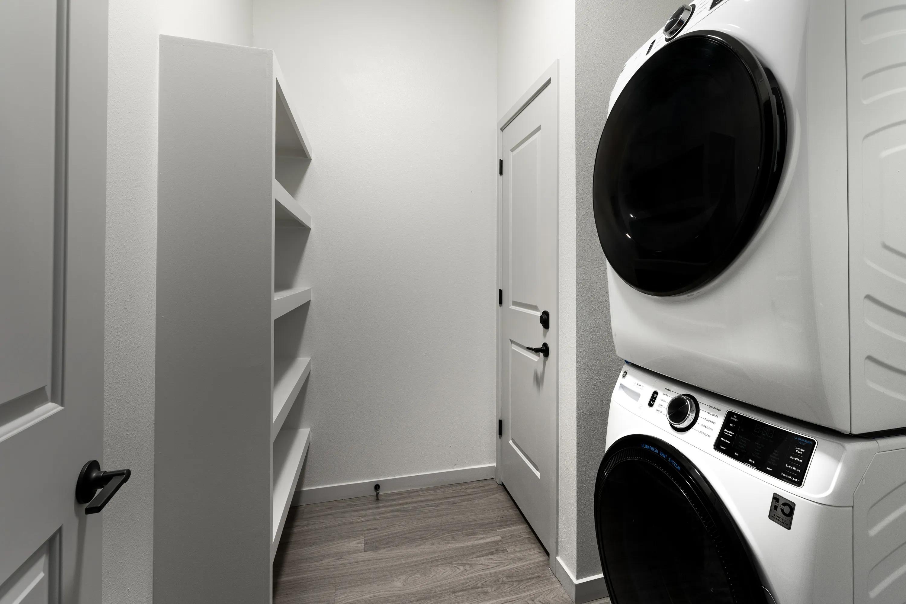 Full-size front loading washers and dryers in apartment at Modera West Wash Park apartments in Denver.