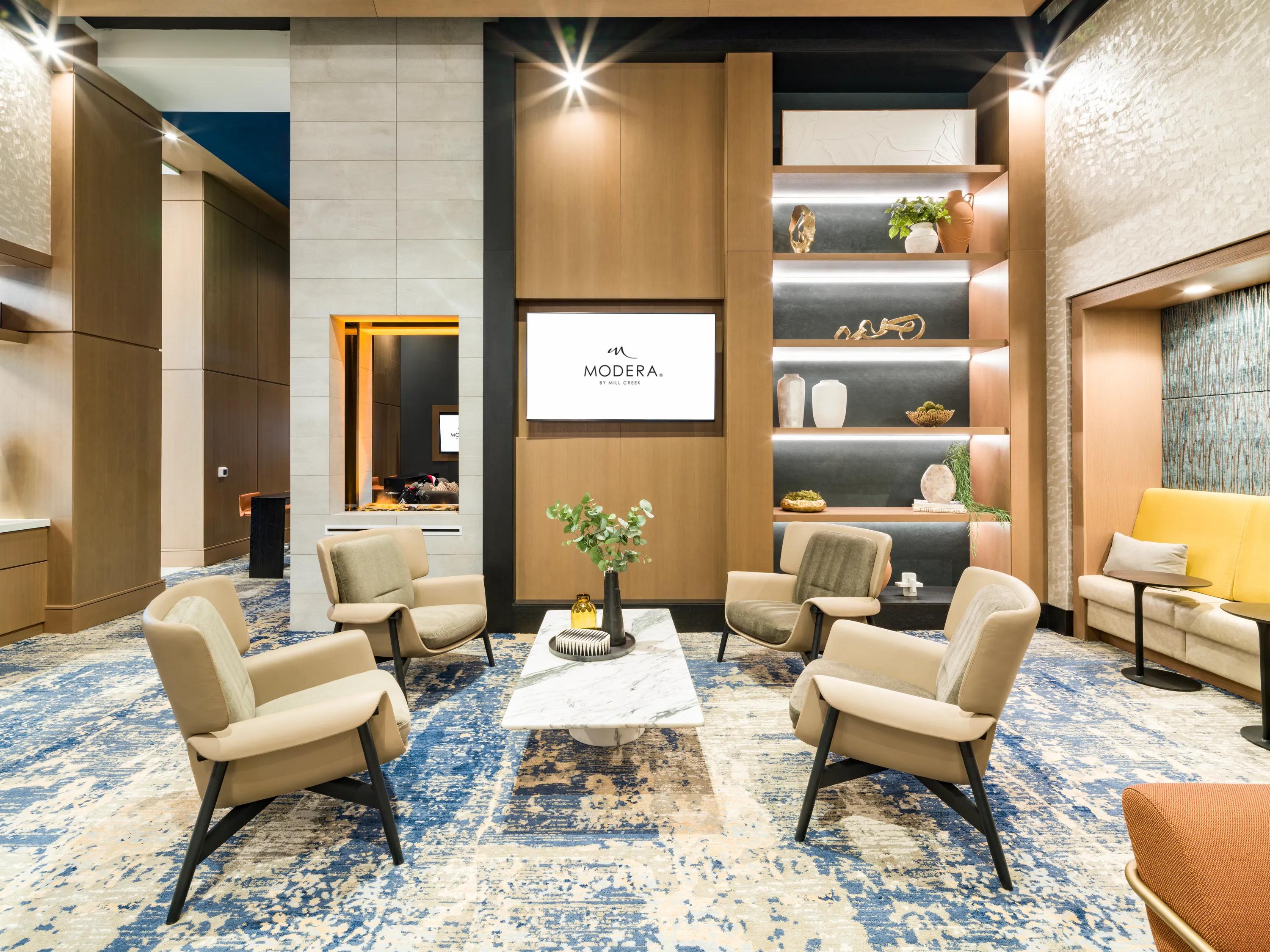 modern clubroom with fireplace and lounge seating modera mcgavock apartment homes for rent in nashville tn