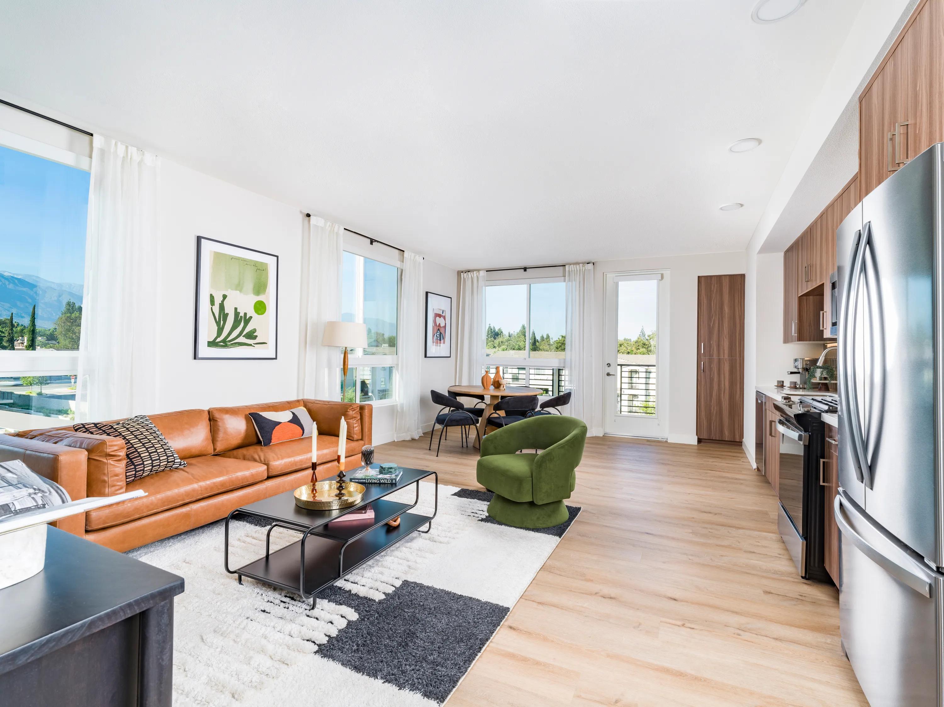 open floor plan living room and kitchen with large windows modera pomona apartment homes for rent in ca