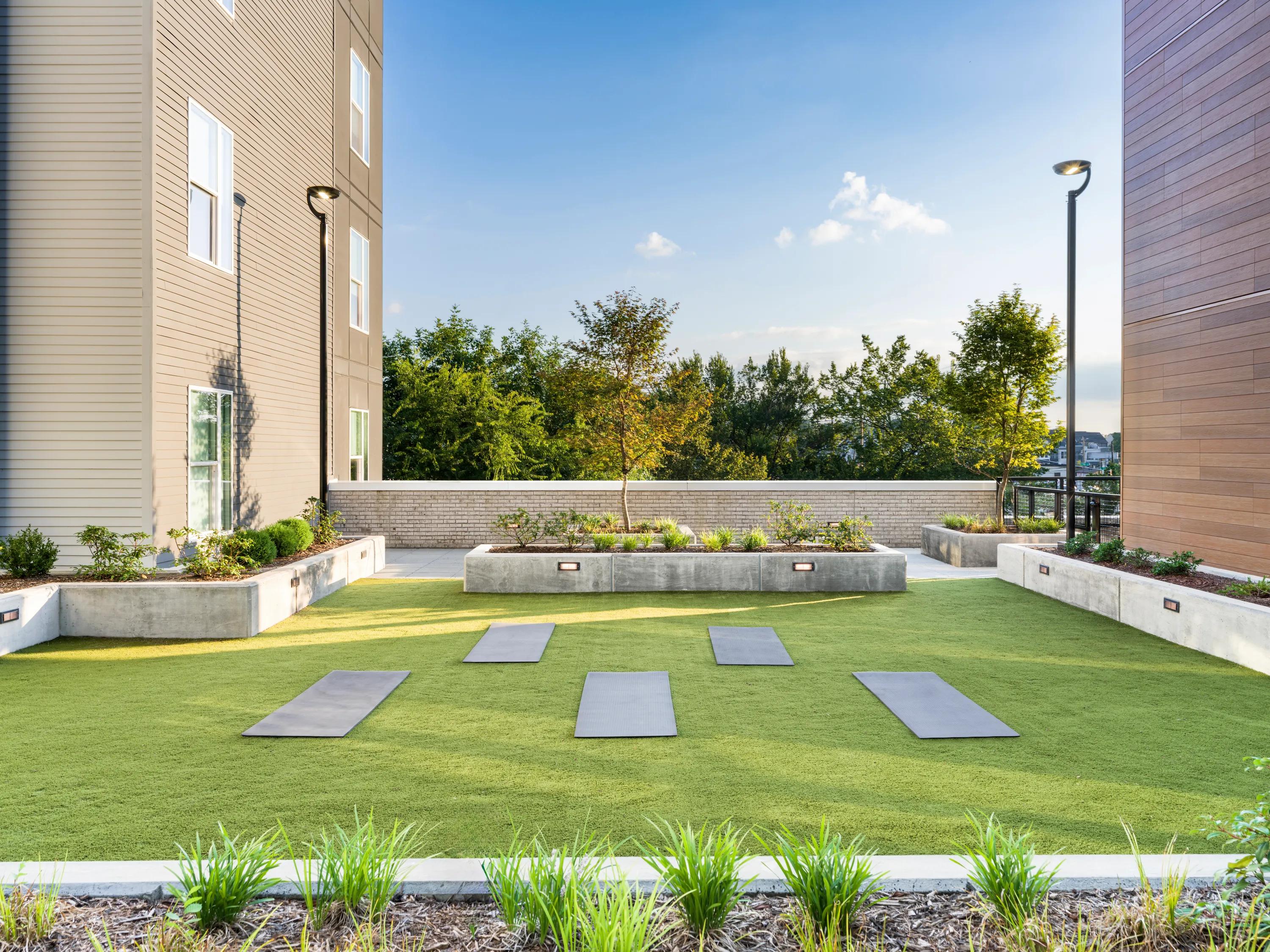 outdoor lawn with yoga mats modera loso apartment homes for rent in charlotte nc