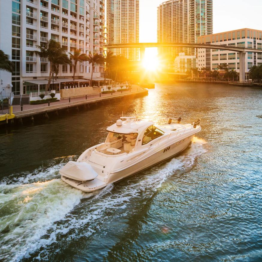 boat floating down river in downtown miami fl modera riverside apartment homes for rent
