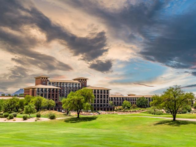 golfer and caddy putting on green modera kierland apartment homes for rent in scottsdale az