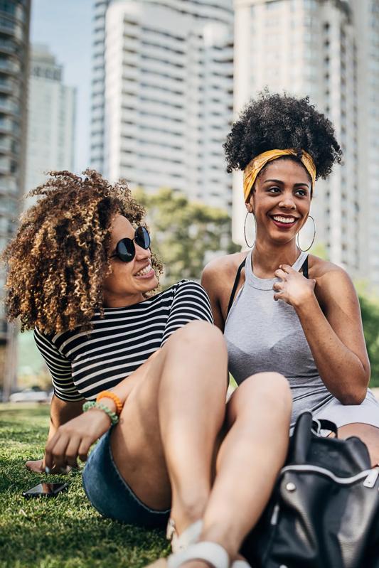 group of girls sitting at a park near modera reynoldstown apartments in atlanta ga