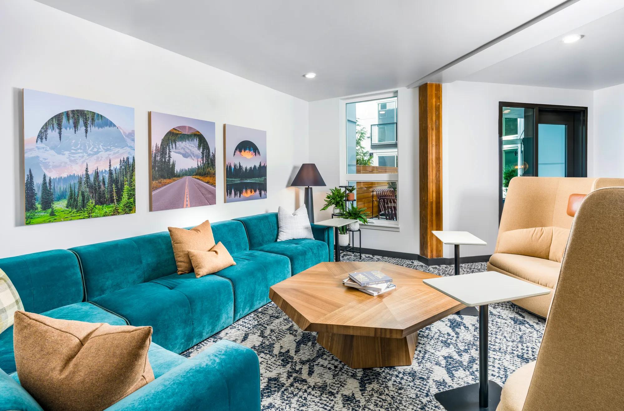 clubroom with comfortable couch and coworking spaces