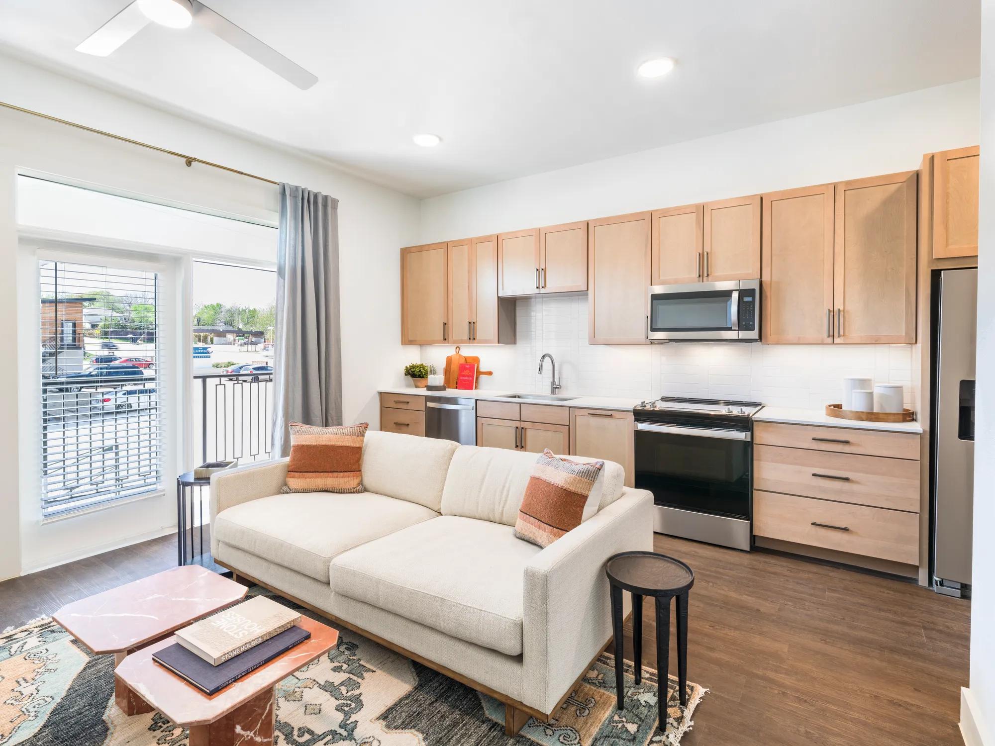 large windows letting light into living room and kitchen modera trailhead apartment homes for rent in dallas texas