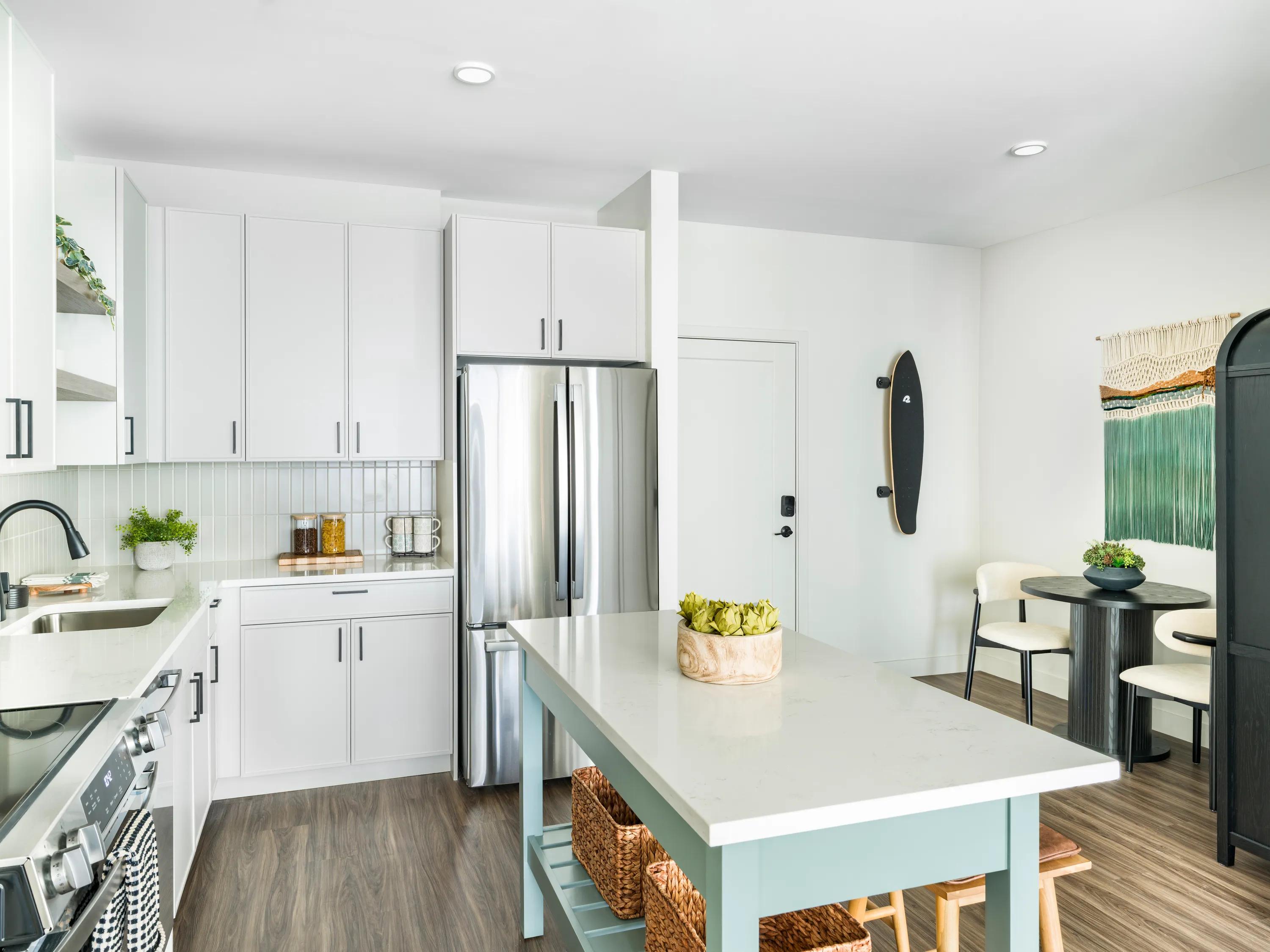 kitchen with light cabinetry and stainless steel appliances modera south shore apartment homes for rent in marshfield ma