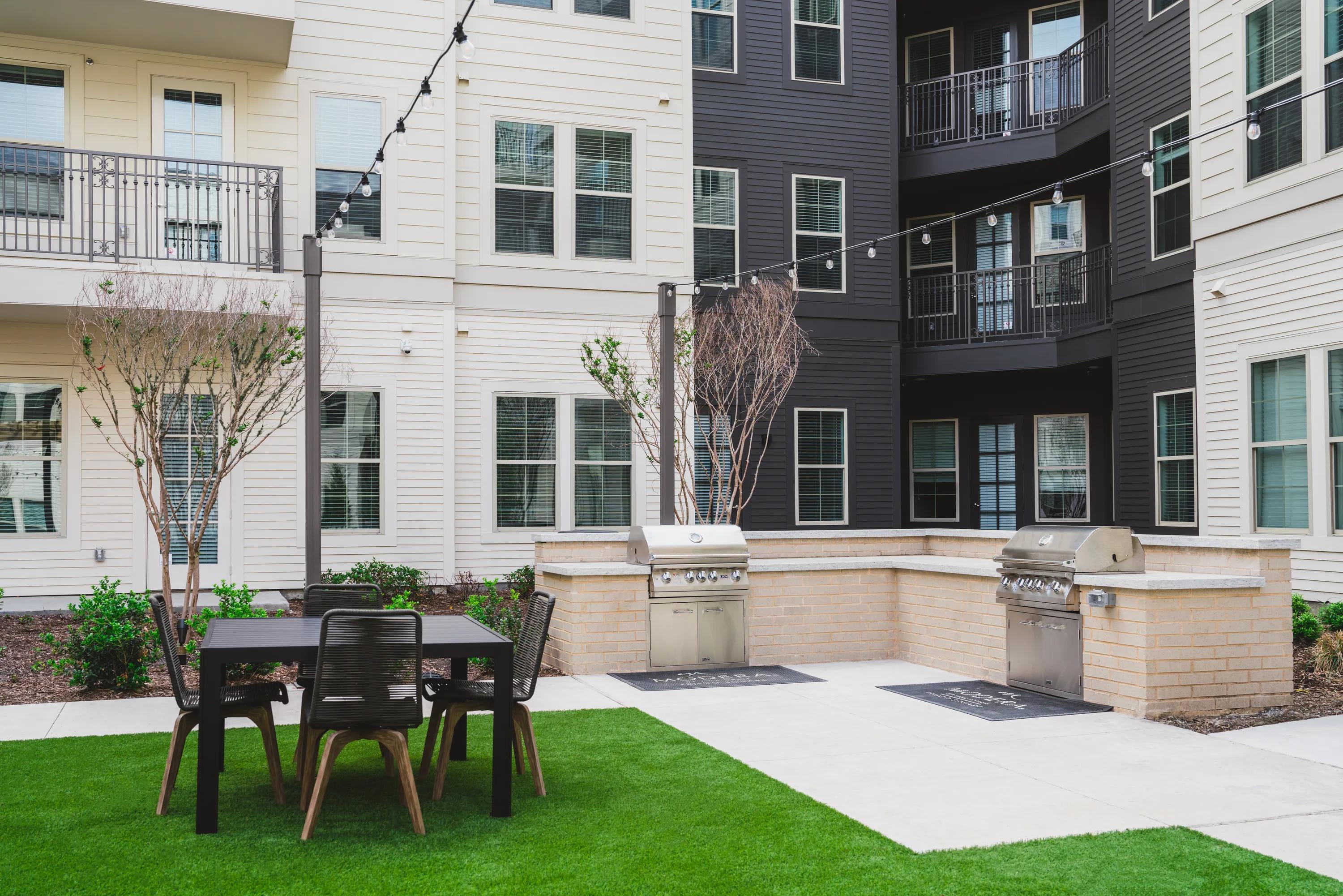 outdoor firepit in courtyard modera frisco square apartment homes for rent in tx