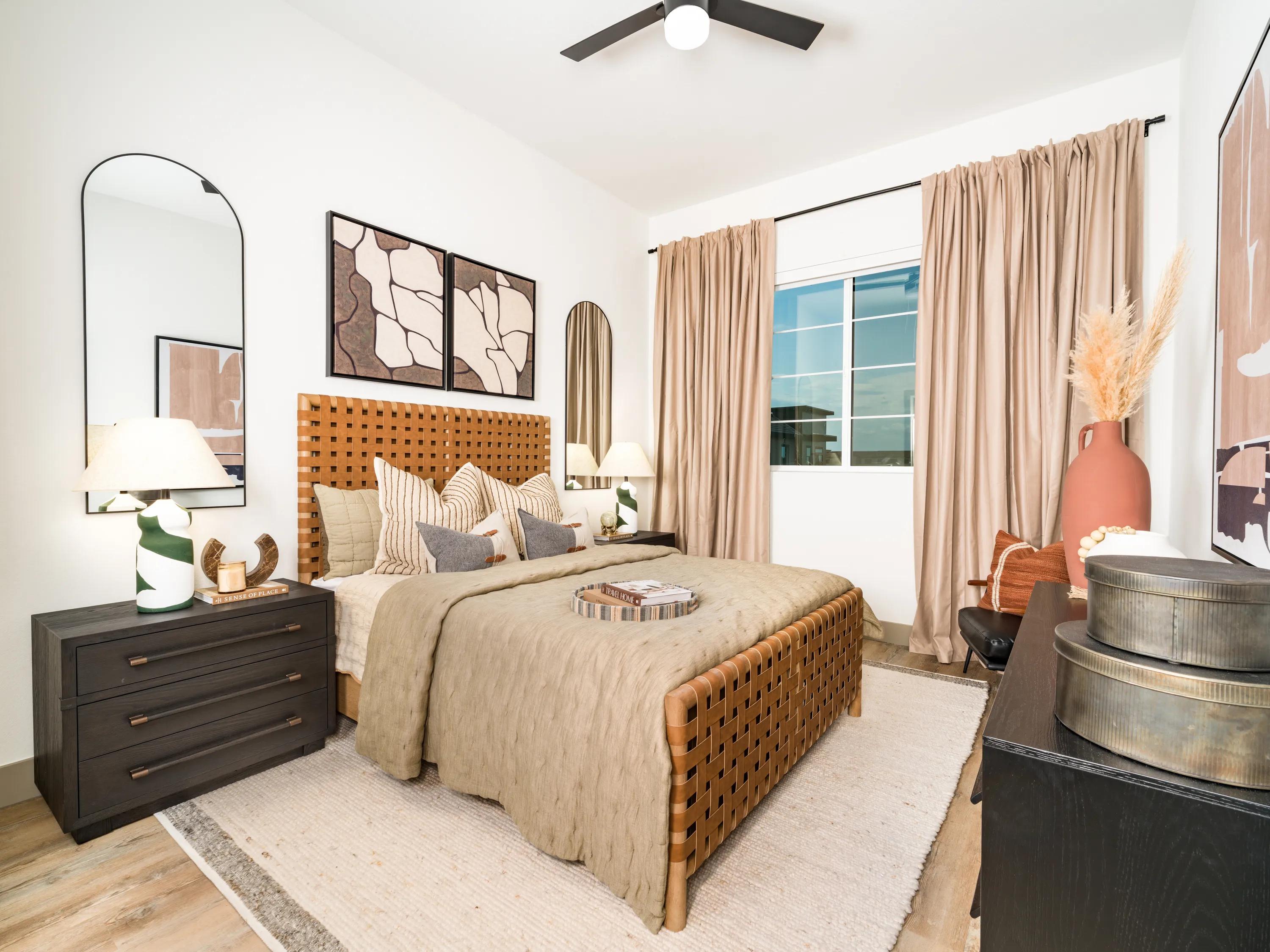 spacious bedroom with large window and ceiling fan modera chandler apartments for rent in chandler az