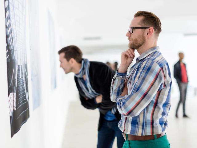 two men in a museum admiring art alister sherman oaks