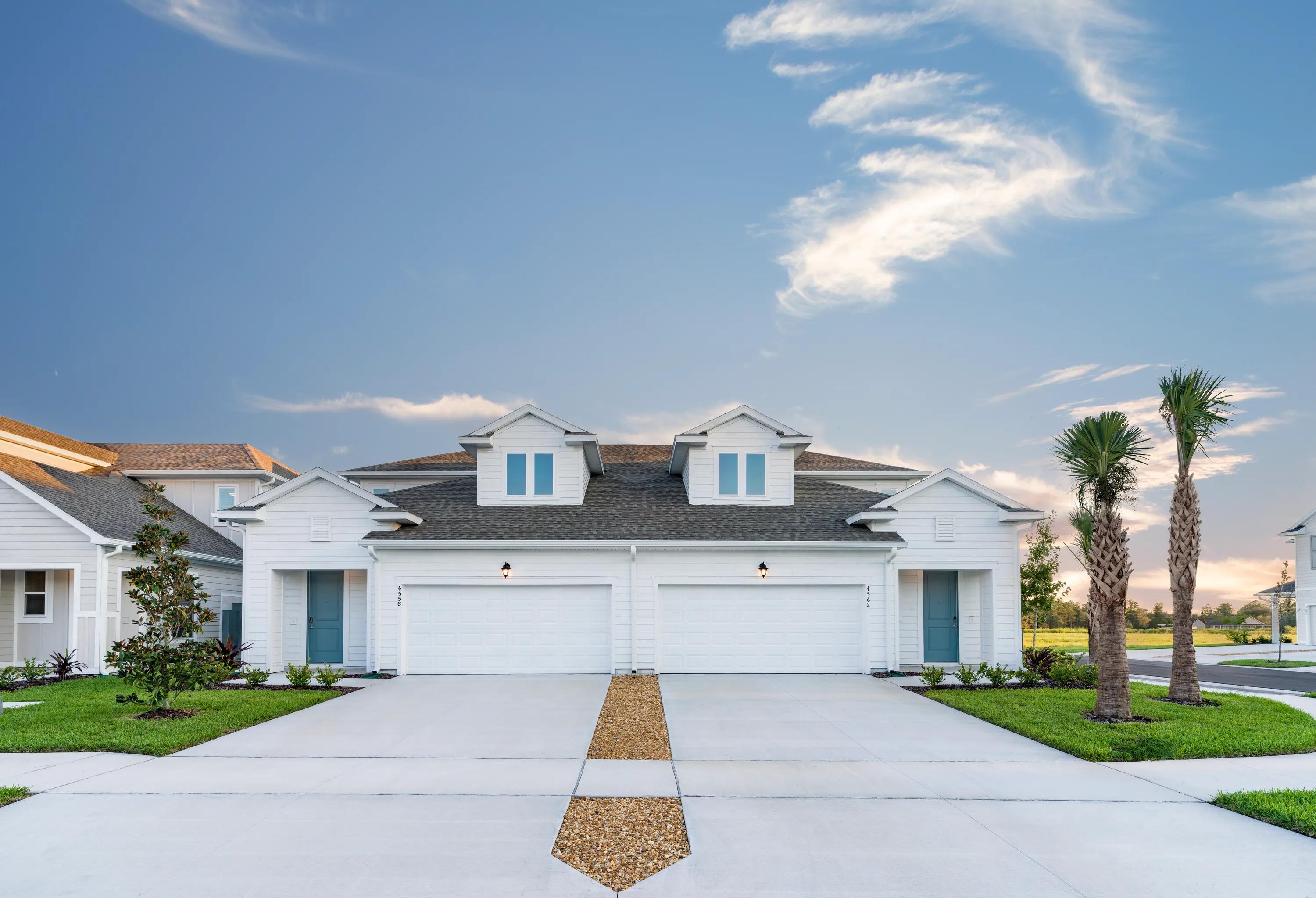 amavi kissimmee exterior duplex style home with 2 garages