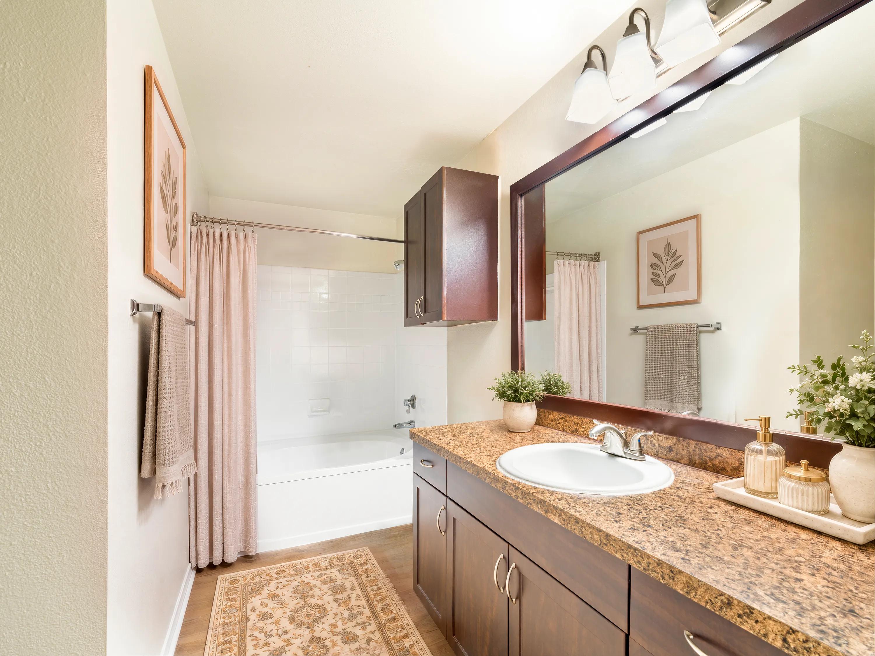 double vanity bathroom with light fixtures alister sunset valley apartment homes for rent in austin tx