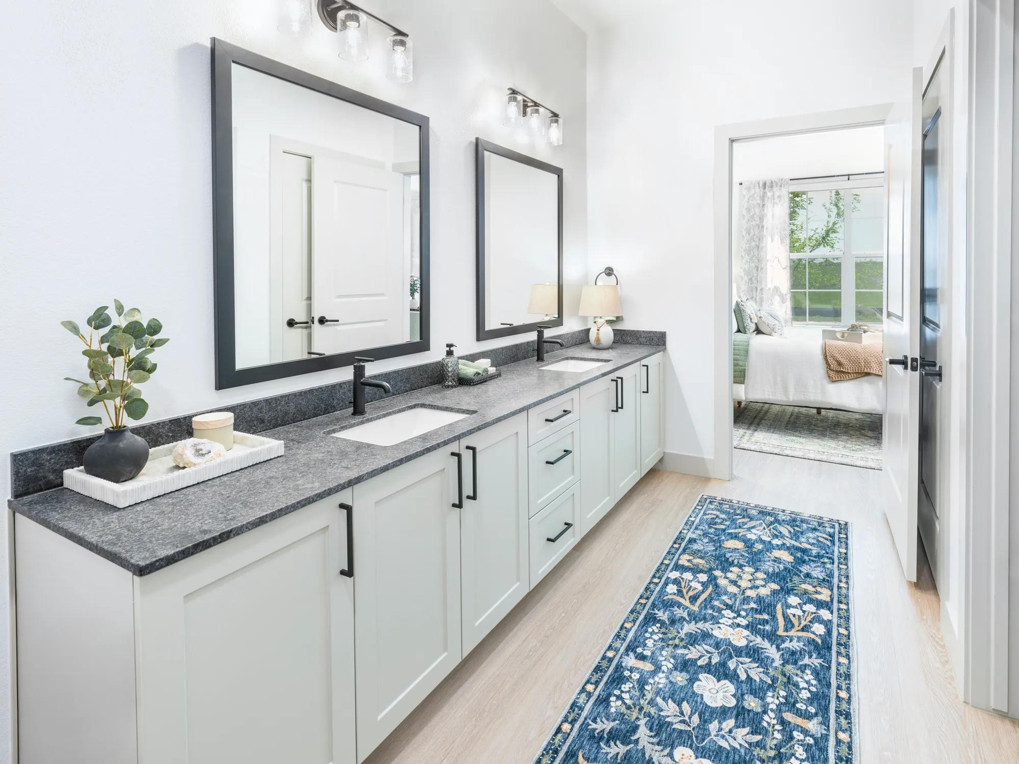 double vanity bathroom leading onto bedroom modera mckinney ridge apartment homes for rent in tx
