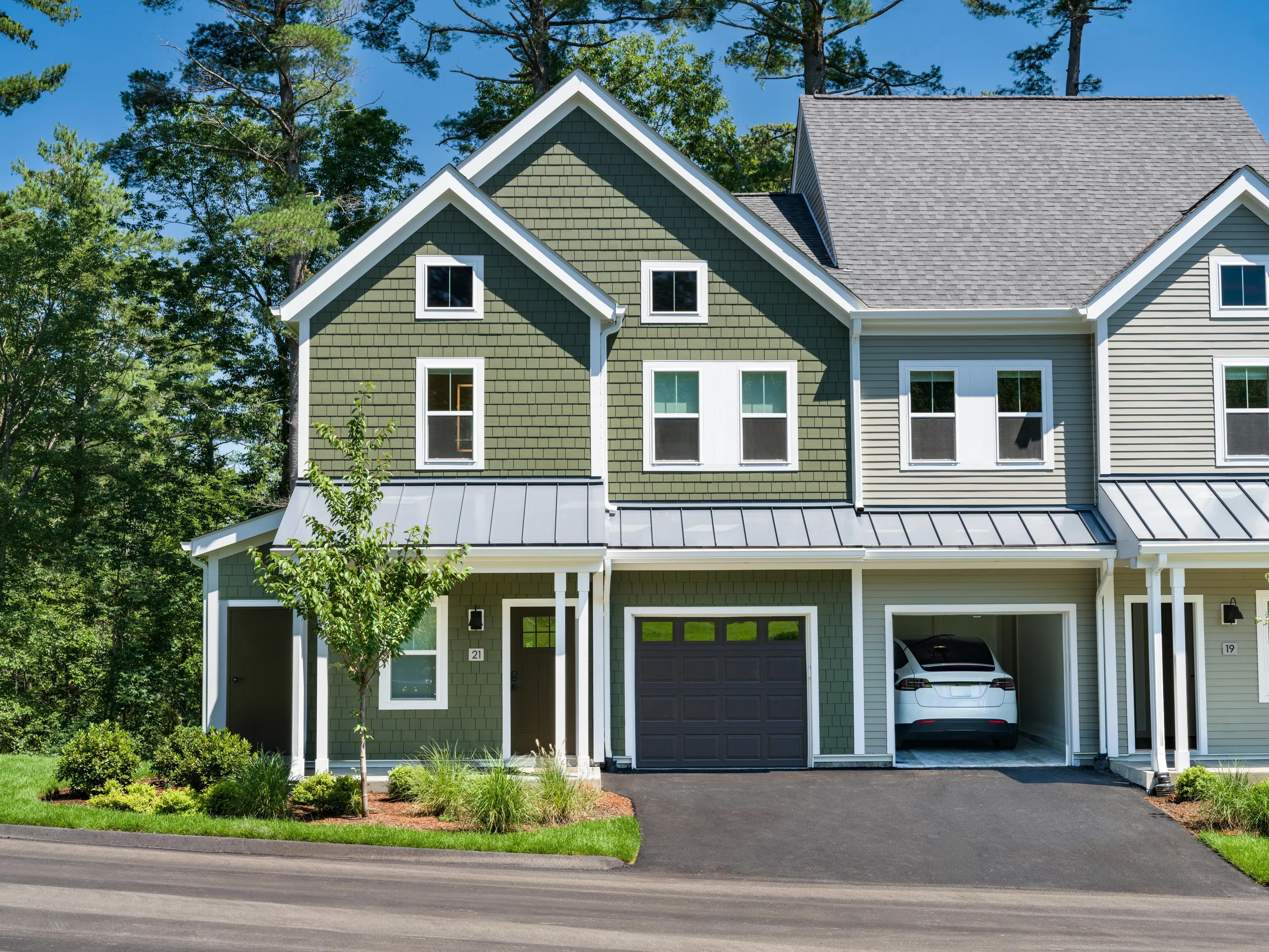 exterior building with garages modera weston apartments for rent in weston ma near boston