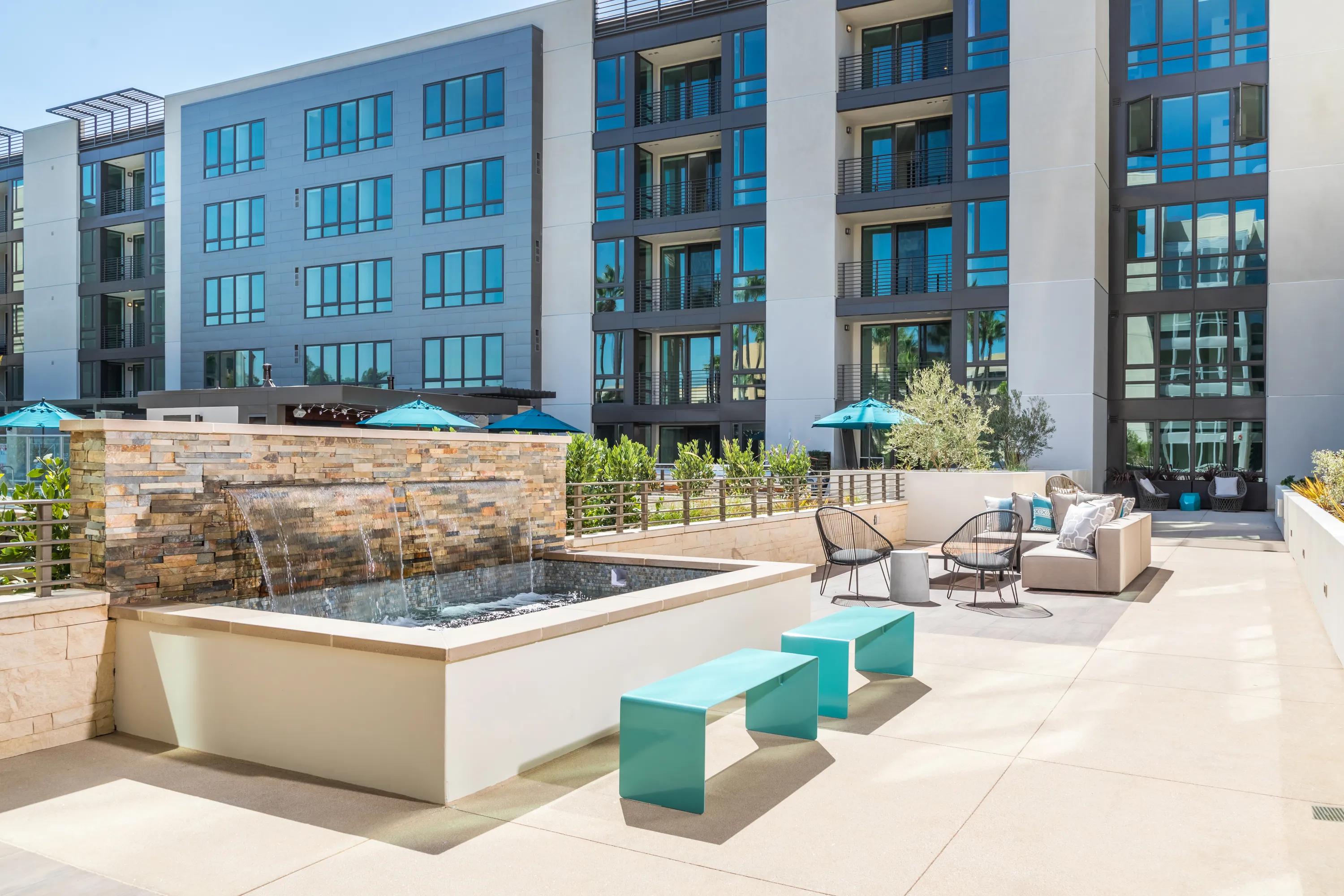 Beautiful outdoor water feature with lounge seating 580 anton apartments