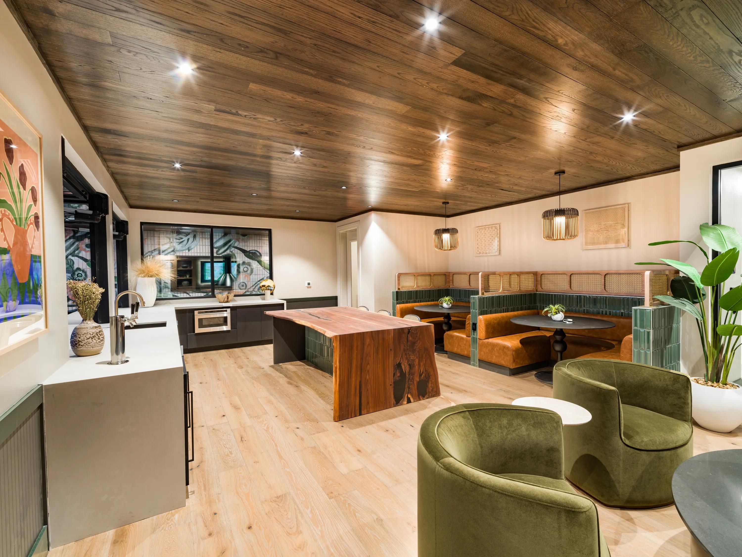 community lounge with ample seating and kitchen area modera st paul apartment homes for rent