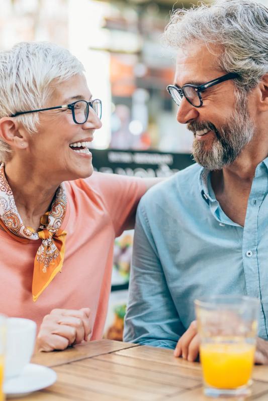 mature couple at brunch smiling at each other at outside dining alister sherman oaks